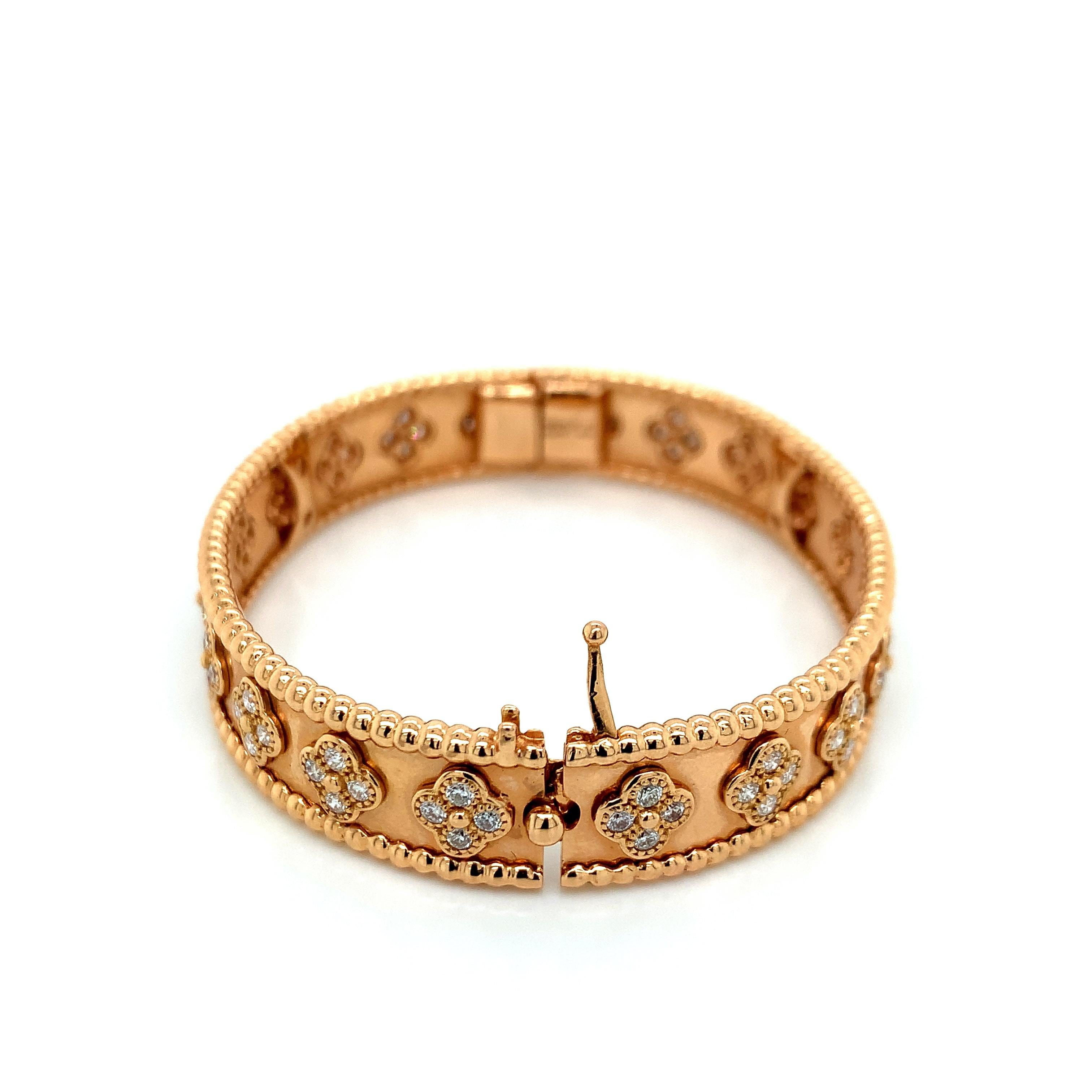 Van Cleef & Arpels 18 karat rose gold hinged bangle with 80 round brilliant cut diamonds weighing approximately 1.60 carat. Comes from VCA's Clover Perlée collection. Serial No. JE143288. Marked: VCA / Au750 / 16 / JE143288. Total weight: 36.4