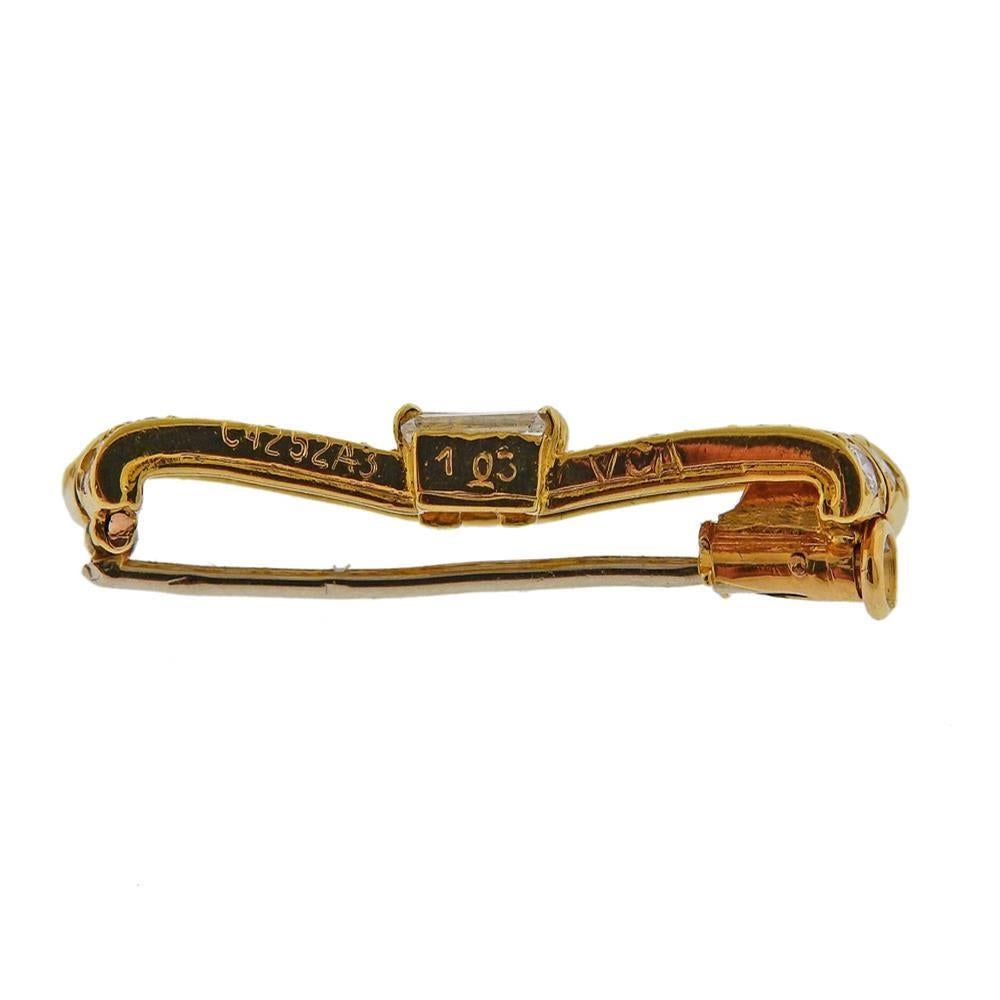 18k gold bow brooch by Van Cleef & Arples, set with approx. 1.03ctw in diamonds. Brooch measures 30mm x 6mm. Marked: 1.03, V.CA., C4252A3. Weight - 2.5 grams.PB-03097