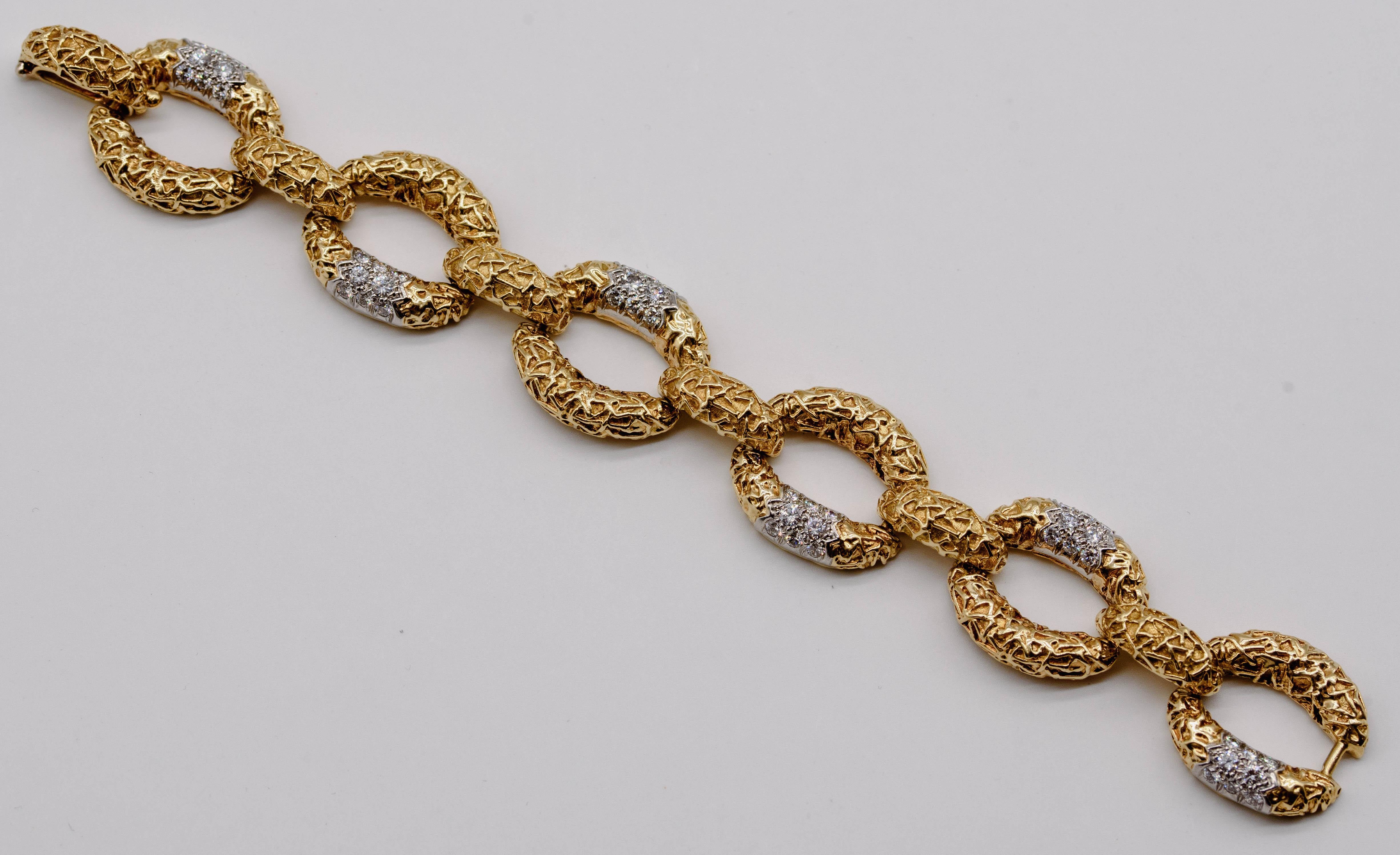 A true classic, this sensational bracelet would be a winner even if it didn't boast the signature of Van Cleef & Arpels, one of the most revered names in signed jewelry. The bracelet consists of six oval textured 18 karat gold links joined by domed