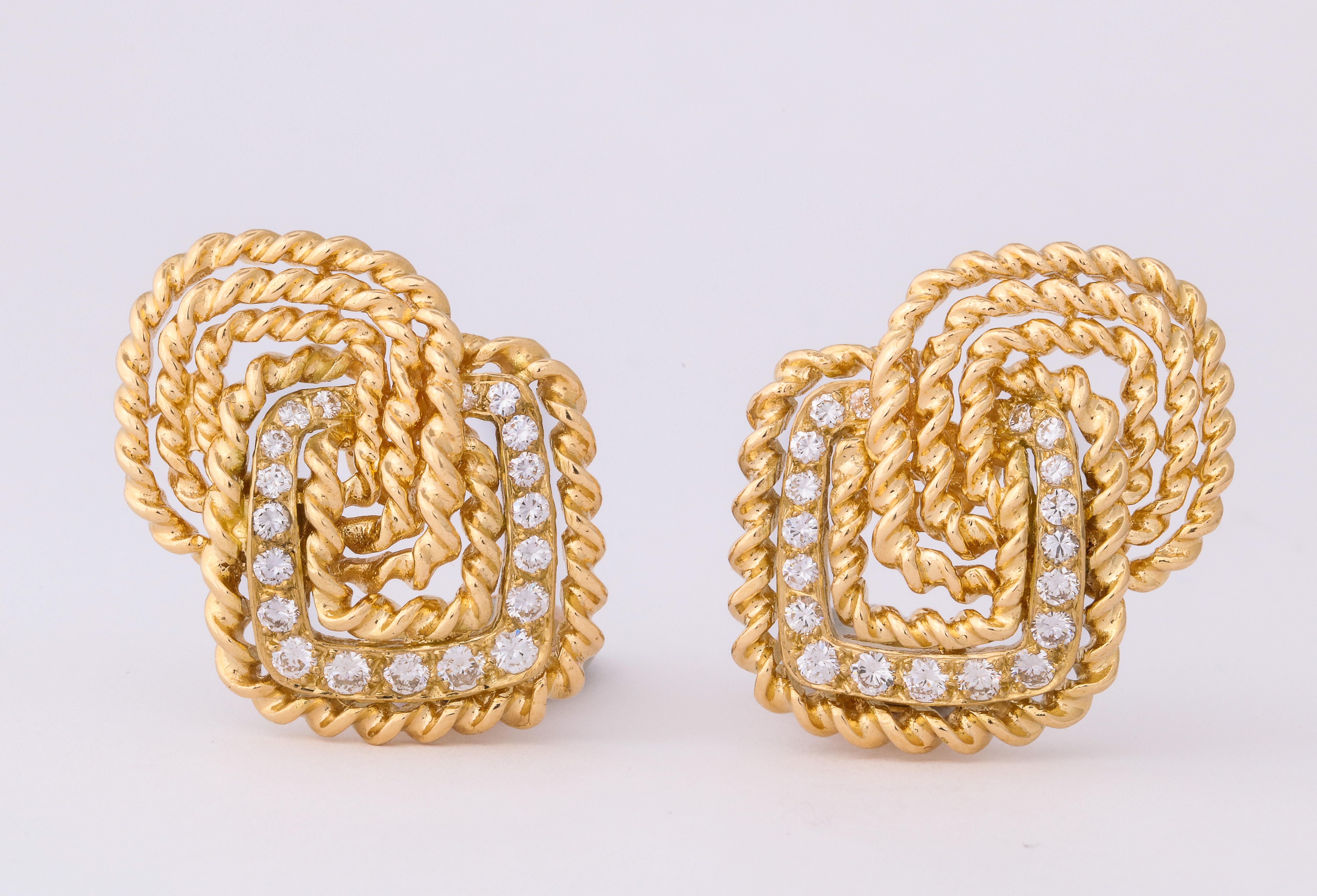 Van Cleef and Arpels was certainly one of the preeminent jewelers of the 1970's, and these bold earclips absolutely epitomize the period.  The twisted, rope gold design is quintessentially V.C.A. and the whitest diamonds add just the right touch of