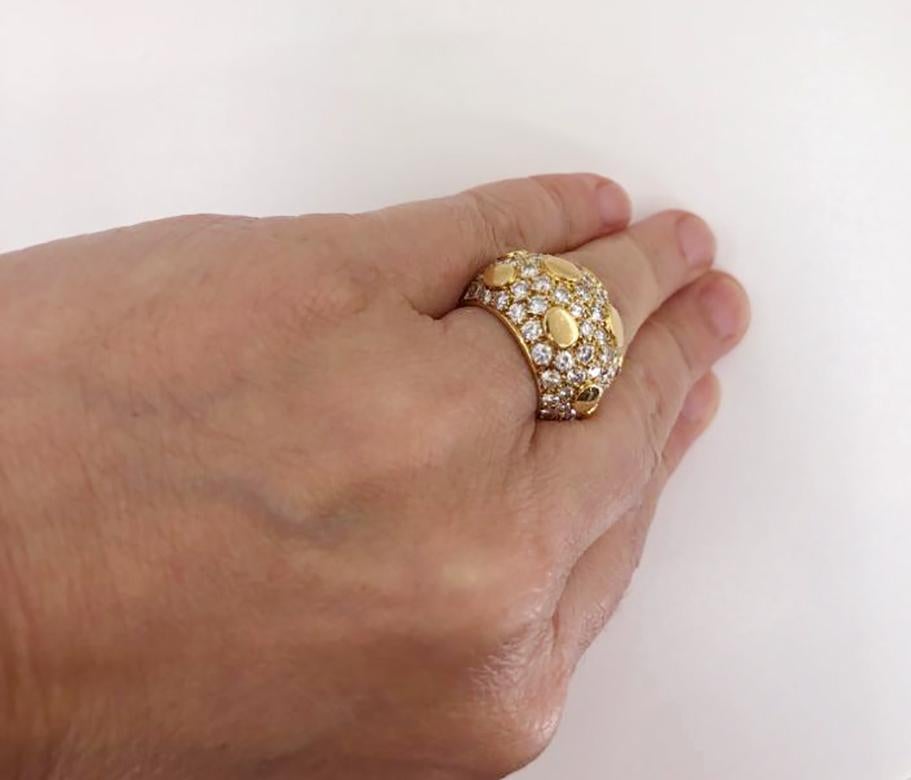 VAN CLEEF & ARPELS Diamond Bombe Sequin Ring in 18k Yellow Gold.
Diamond weight approx. 3.90 carats total. Measures approx. 0.65″ in width tapering to approx. 0.25″, 1″ in length, 0.35″ in height off the finger. Currently fits a size US 5; can be