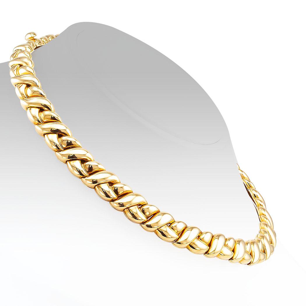 Van Cleef & Arpels gold necklace circa 1990. Designed as a tightly woven braid crafted in 18-karat yellow gold, signed Van Cleef & Arpels. We love that this beautiful, elegant necklace is designed by Van Cleef & Arpels. A brand that is recognized as