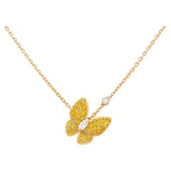 Colgante Van Cleef & Arpels de oro con diamantes redondos y talla marquesa y dos mariposas