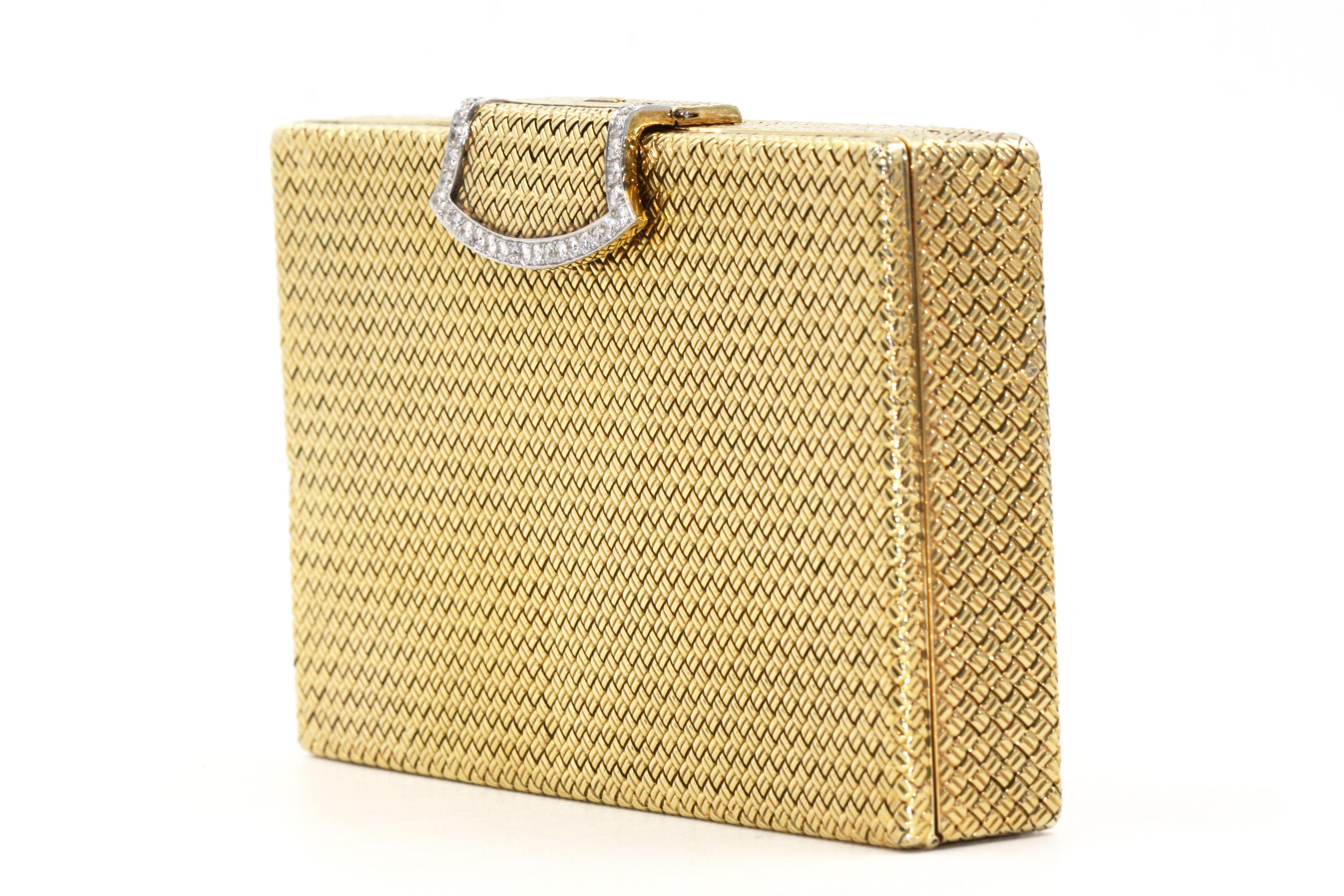 This gold compact is made by the highly important Paris Jewelry House, Van Cleef & Arpels. 
The compact is of rectangular shape with fine basket-weave decoration. 
The front of the compact has golden clip with diamonds decorated around, opener to