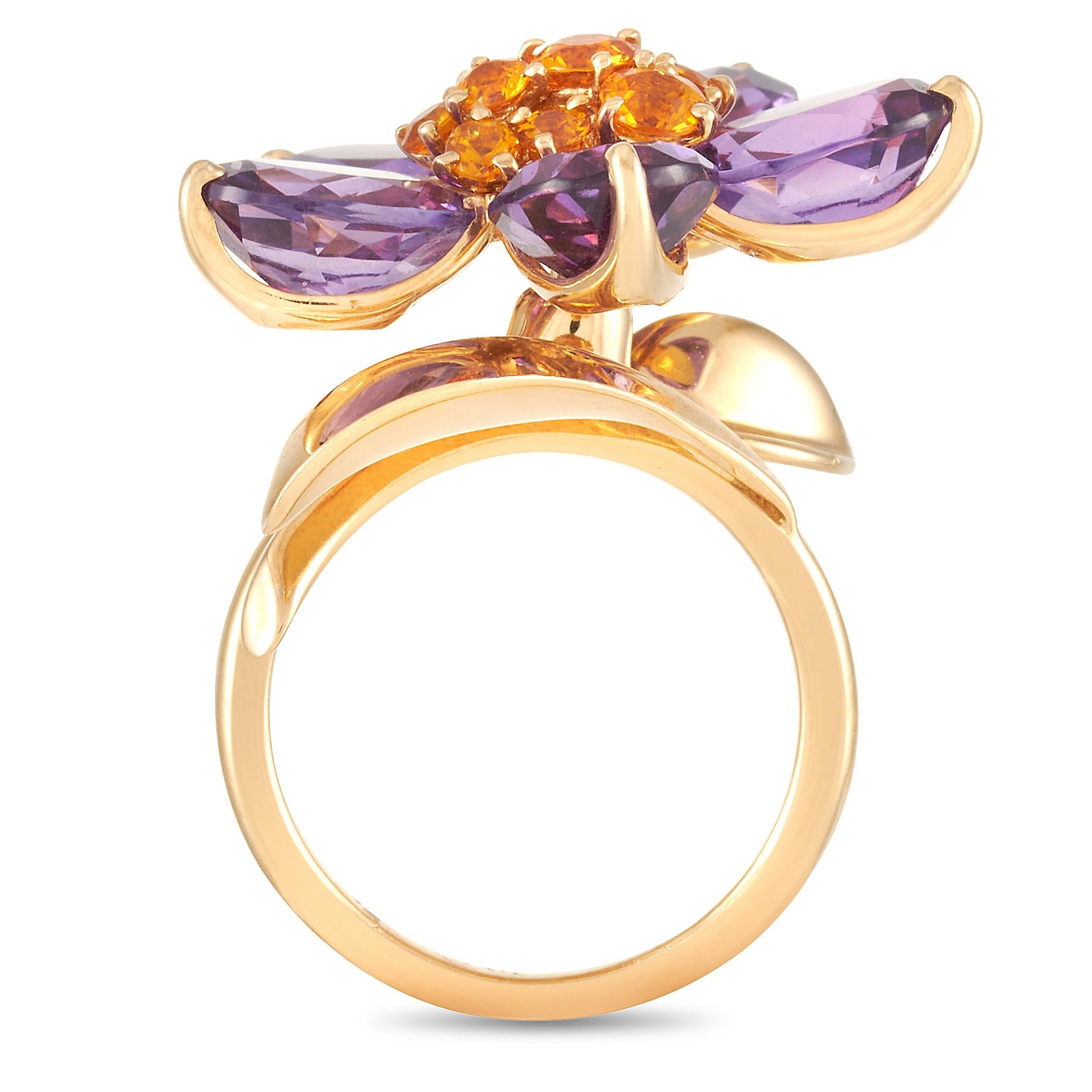 This Van Cleef & Arpels Hawaii 18K Yellow Gold Amethyst and Citrine Flower Ring is a showstopping piece made with an 18K yellow gold band and set with a cluster of citrines surrounded by five beautiful amethysts forming a lovely gemstone bloom. The