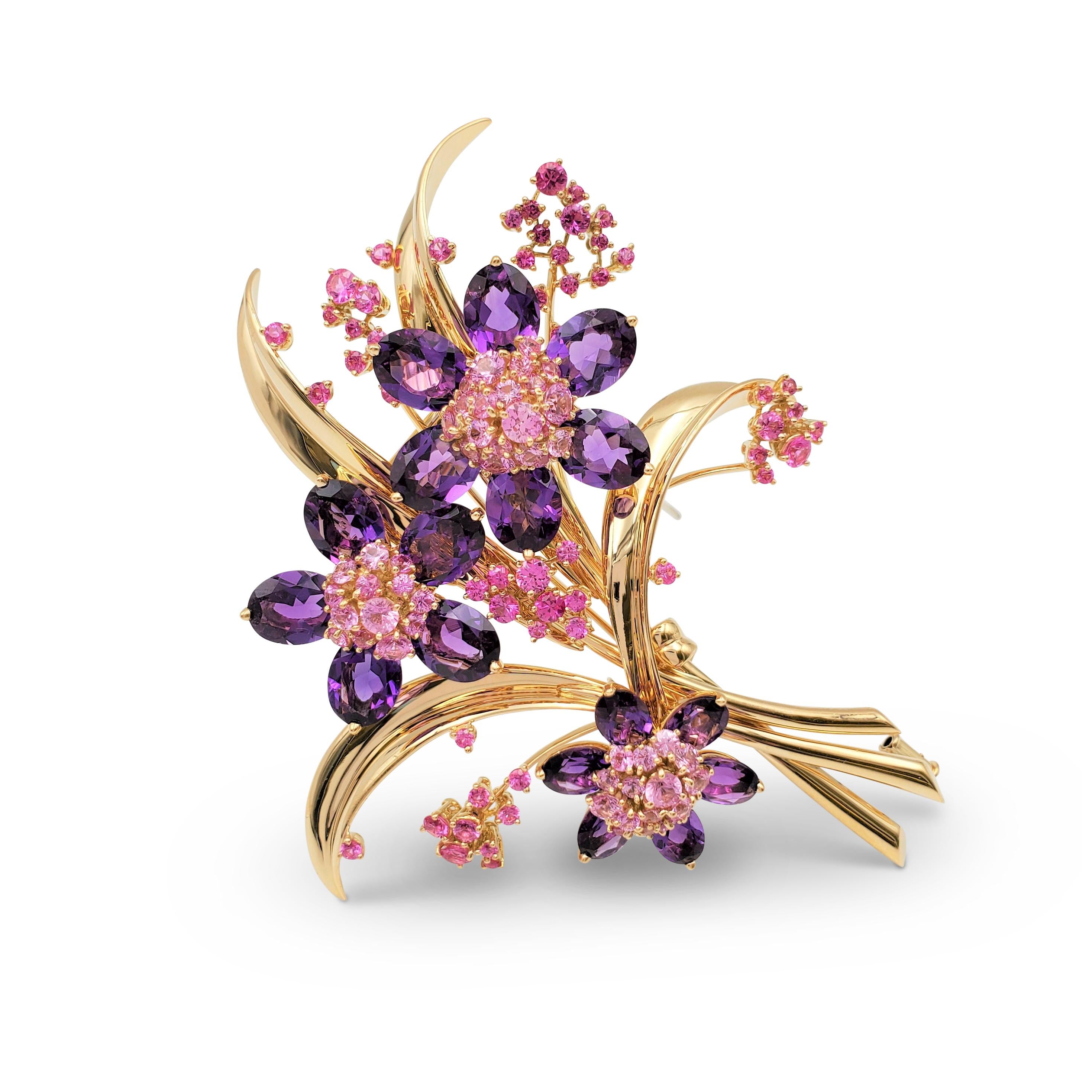 Authentic Van Cleef & Arpels 'Hawaii Bouquet' brooch. Designed as a foliate spray clip with three larger flower motifs, each flower is set with a cluster of round graduated pink sapphires, surrounded by oval-shaped amethyst petals, with smaller pink