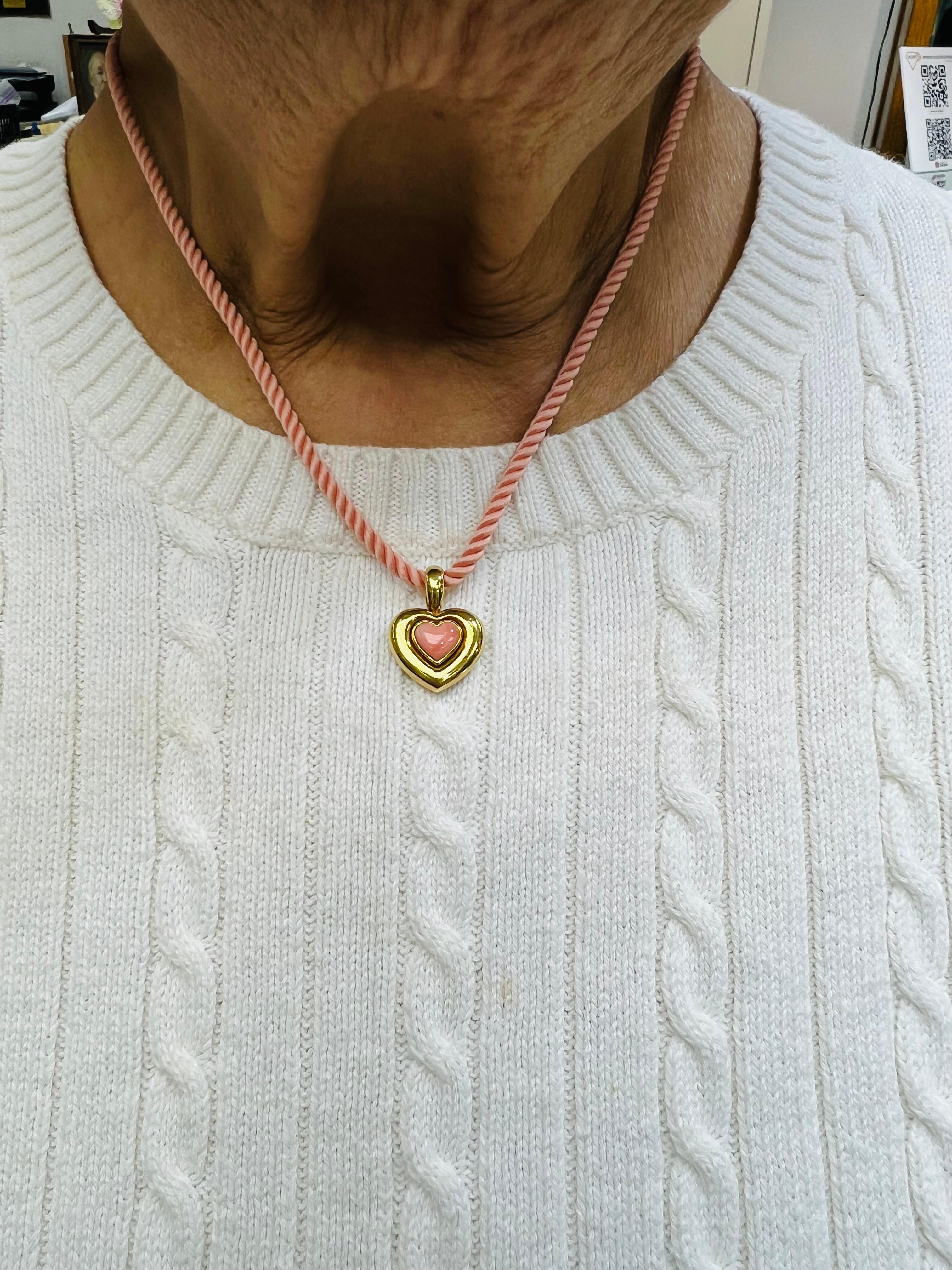 Van Cleef & Arpels heart-shaped coral yellow gold pendant necklace, circa 1990s.

This lovely Van Cleef & Arpels heart-shaped coral and yellow gold pendant necklace from the 1990s is set with one heart-shaped cabochon pink coral stone and is