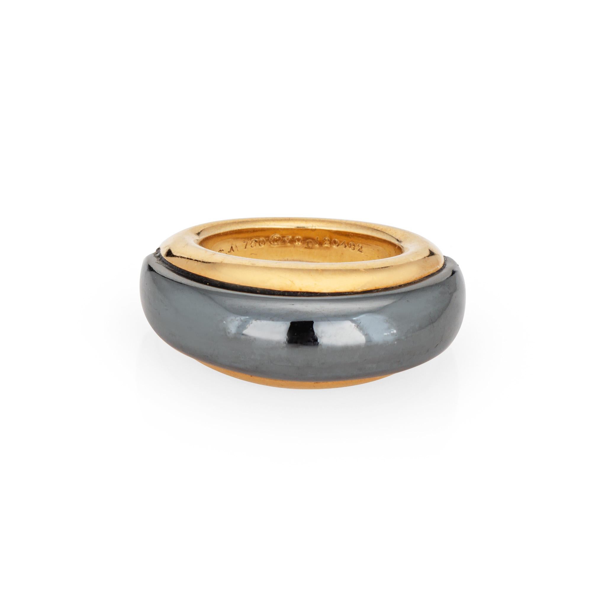 Vintage Van Cleef & Arpels hematite & 18k yellow gold dome ring (circa 1970s to 1980s).  

The stylish ring highlights a domed hematite center bordered with an 18k yellow gold design. The ring is great worn alone or stacked with your fine jewelry