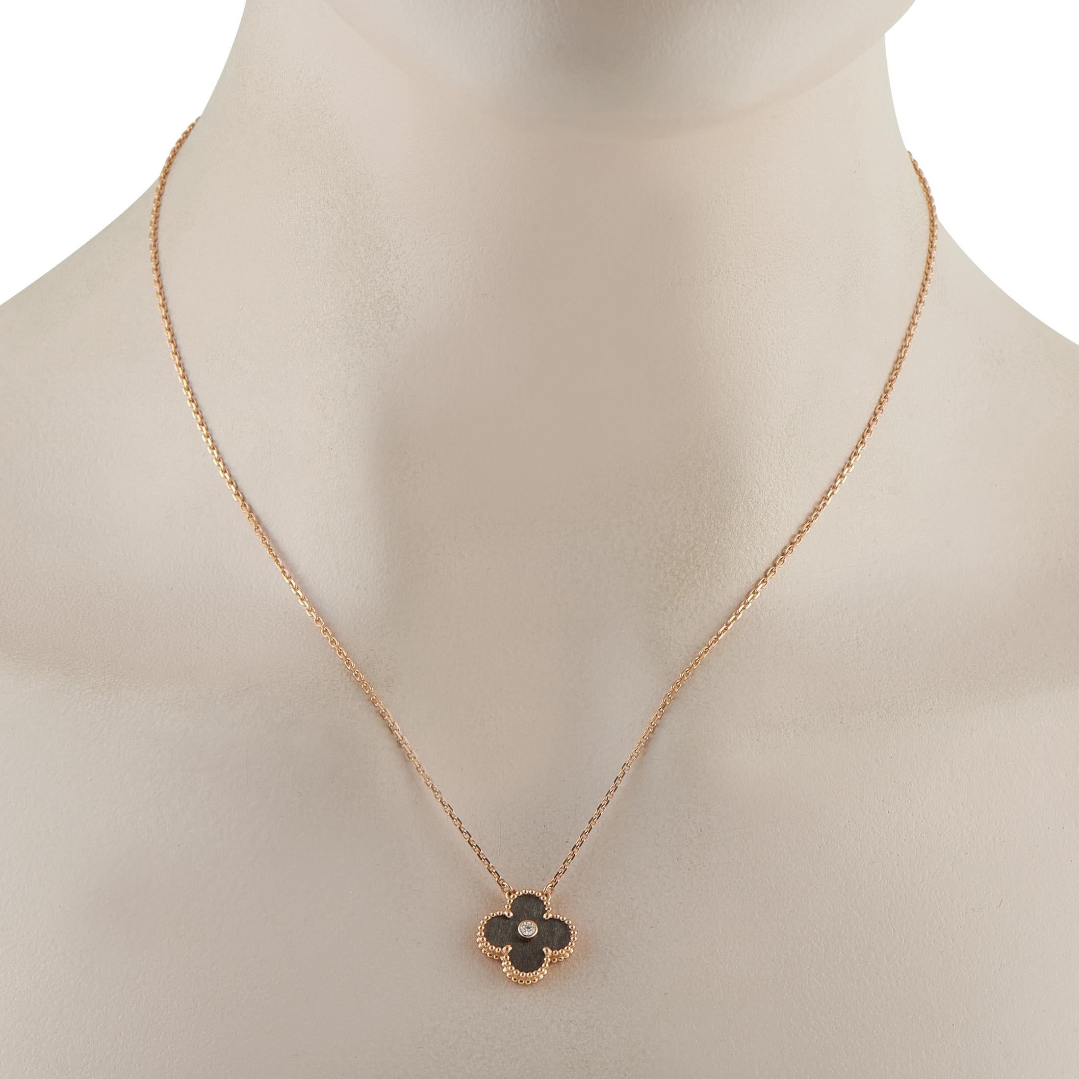 This Van Cleef & Arpels Holiday Alhambra necklace is the perfect piece for collectors or anyone who appreciates timeless luxury. A dark gray stone surrounds a single Diamond at the center of the iconic clover-shaped pendant. Set in 18K Rose Gold,