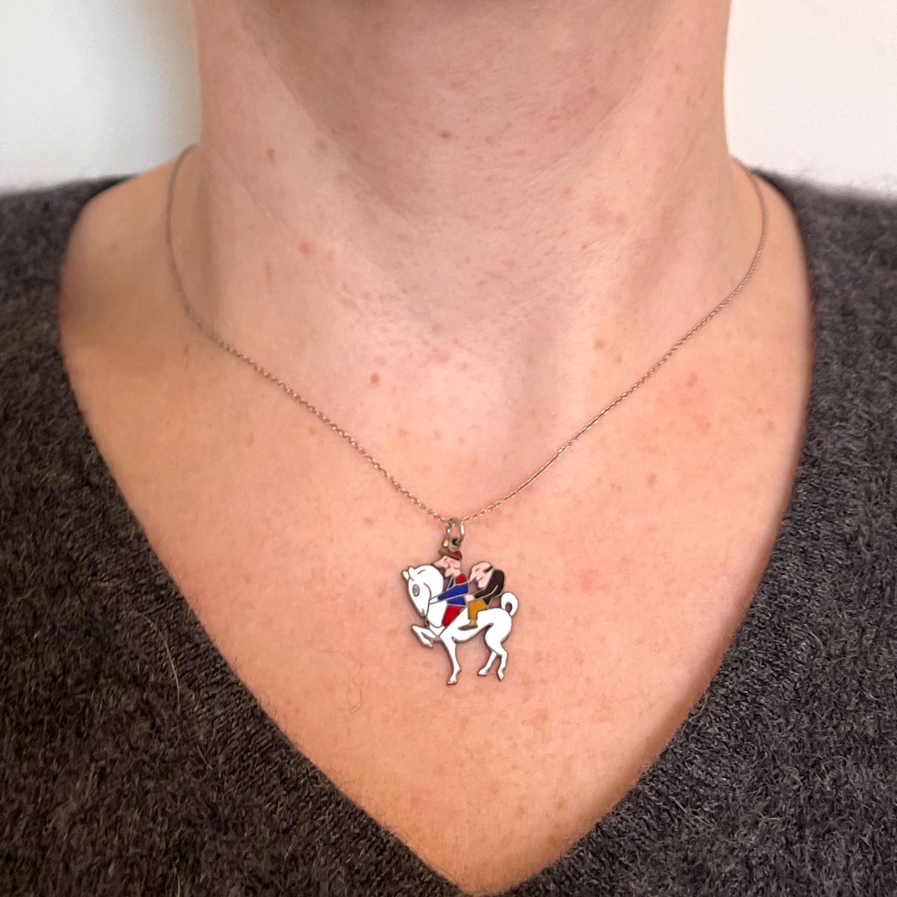 A classic Art Deco charm pendant by Van Cleef et Arpels in styptor with multi-coloured enamel depicting 