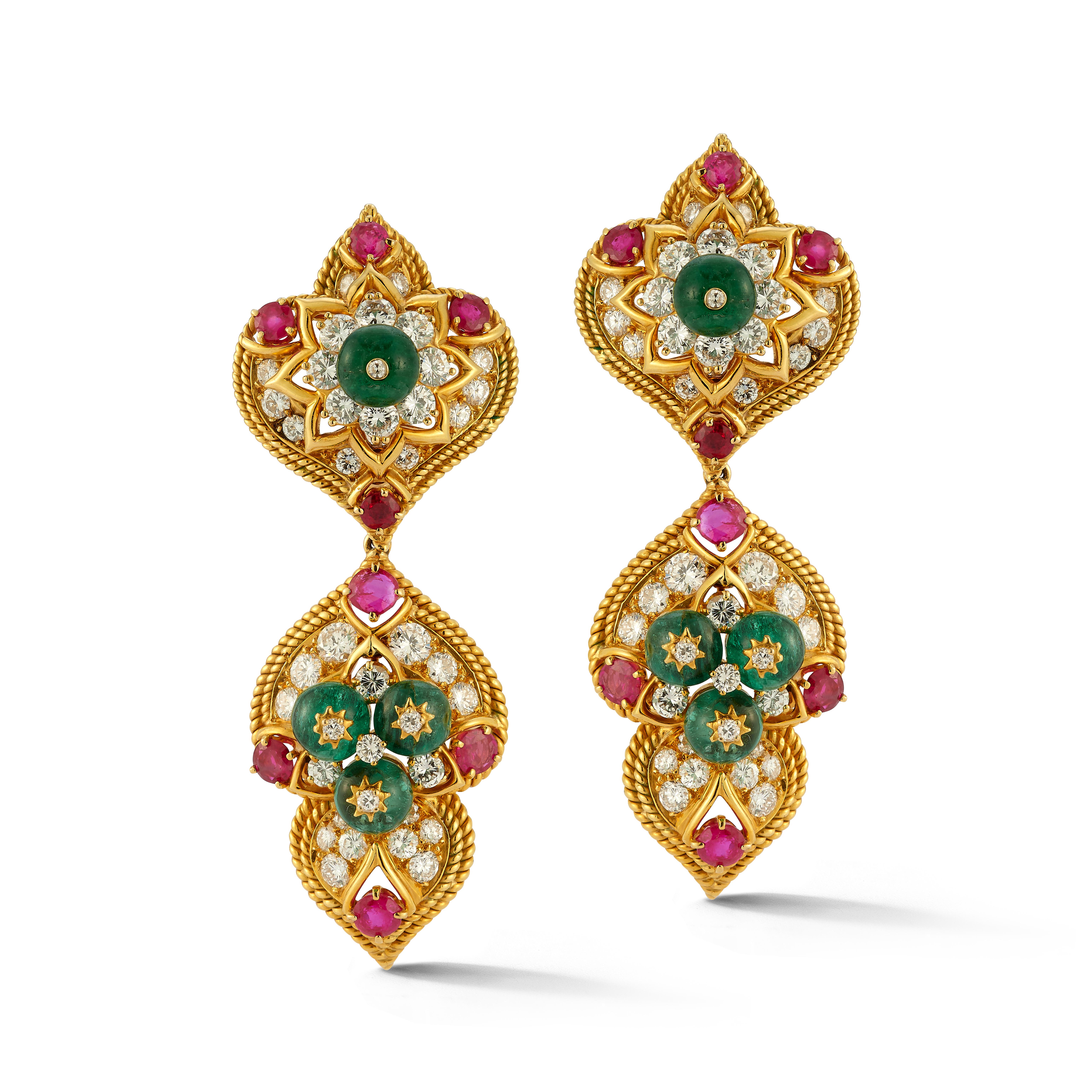 Van Cleef & Arpels Indian Inspired Day & Night Earrings

A pair of 18 karat yellow gold earrings set with 80 round cut diamonds, 16 round cut rubies, and 8 emerald beads

Signed Van Cleef & Arpels NY and numbered

Approximate Diamond Information: