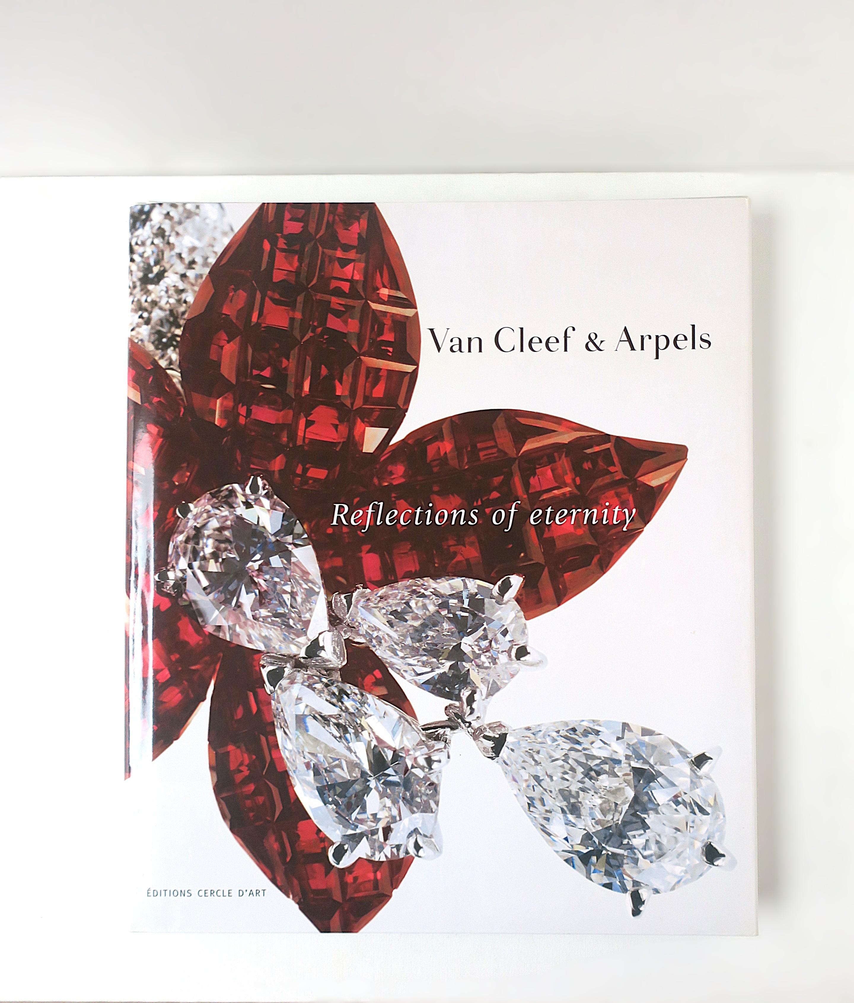 The very beautiful 'Reflections of Eternity' jewelry coffee table book from luxury Maison, Van Cleef & Arpels. Book was published to mark the Centenary (100th Anniversary) of Van Cleef & Arpels (VCA.) Book reveals the philosophy and the aesthetics