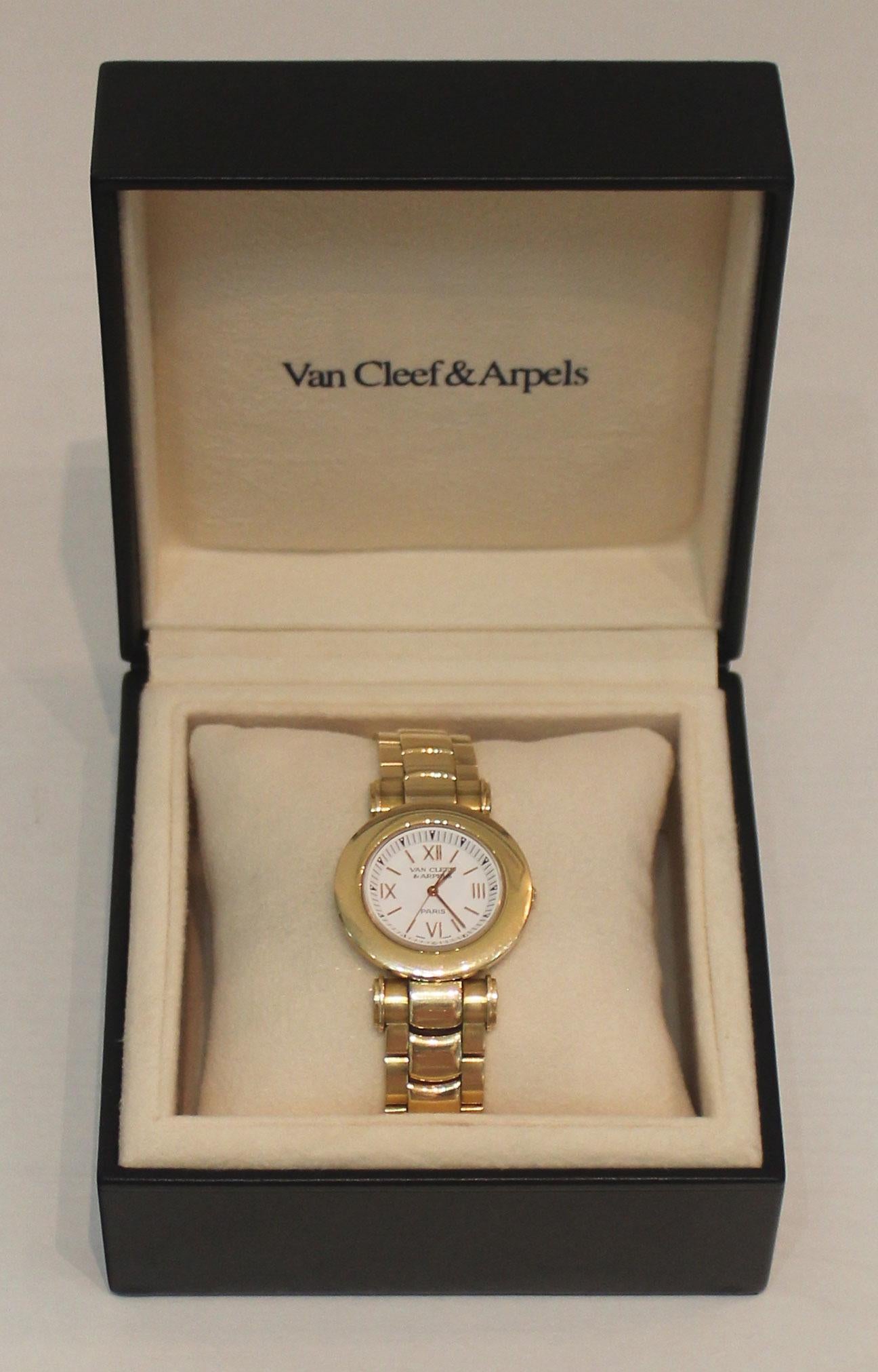 Van Cleef & Arpels Ladies 18K Yellow Gold Dress Watch - This watch is Swiss made with a quartz movement. The case is 33.5 mm and the watch weighs 120.5 grams w/solid gold links. The watch is 6.5 inches long with 2 extra links that add one additional