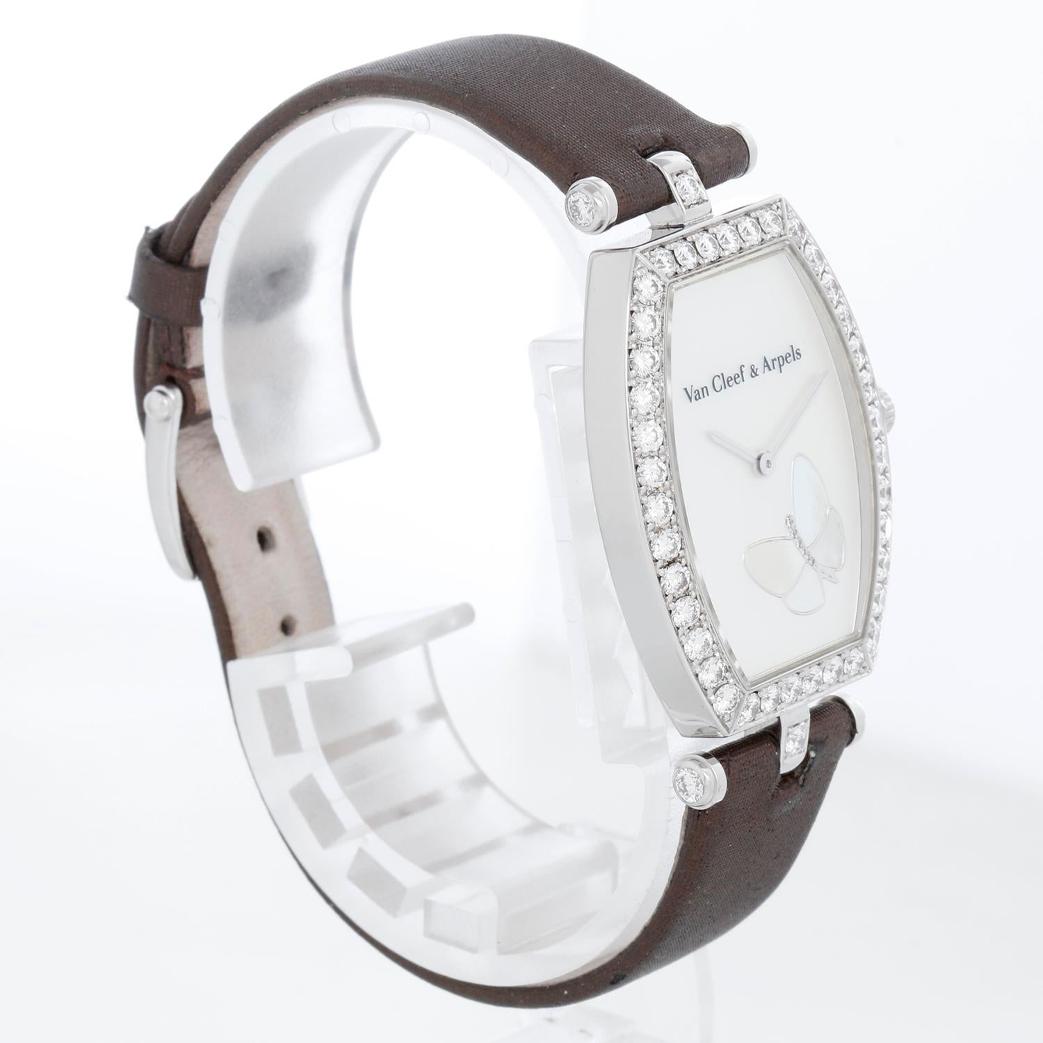 Van Cleef & Arpels Lady Arpels 18K White Gold Papillon Tonneau Watch - Quartz. 18K White Gold tonneau case with diamond bezel ( 26 x 333 mm). Mother of pearl dial with Mother of pearl butterfly with diamonds. Van Cleef & Arpels Strap with Van Cleef