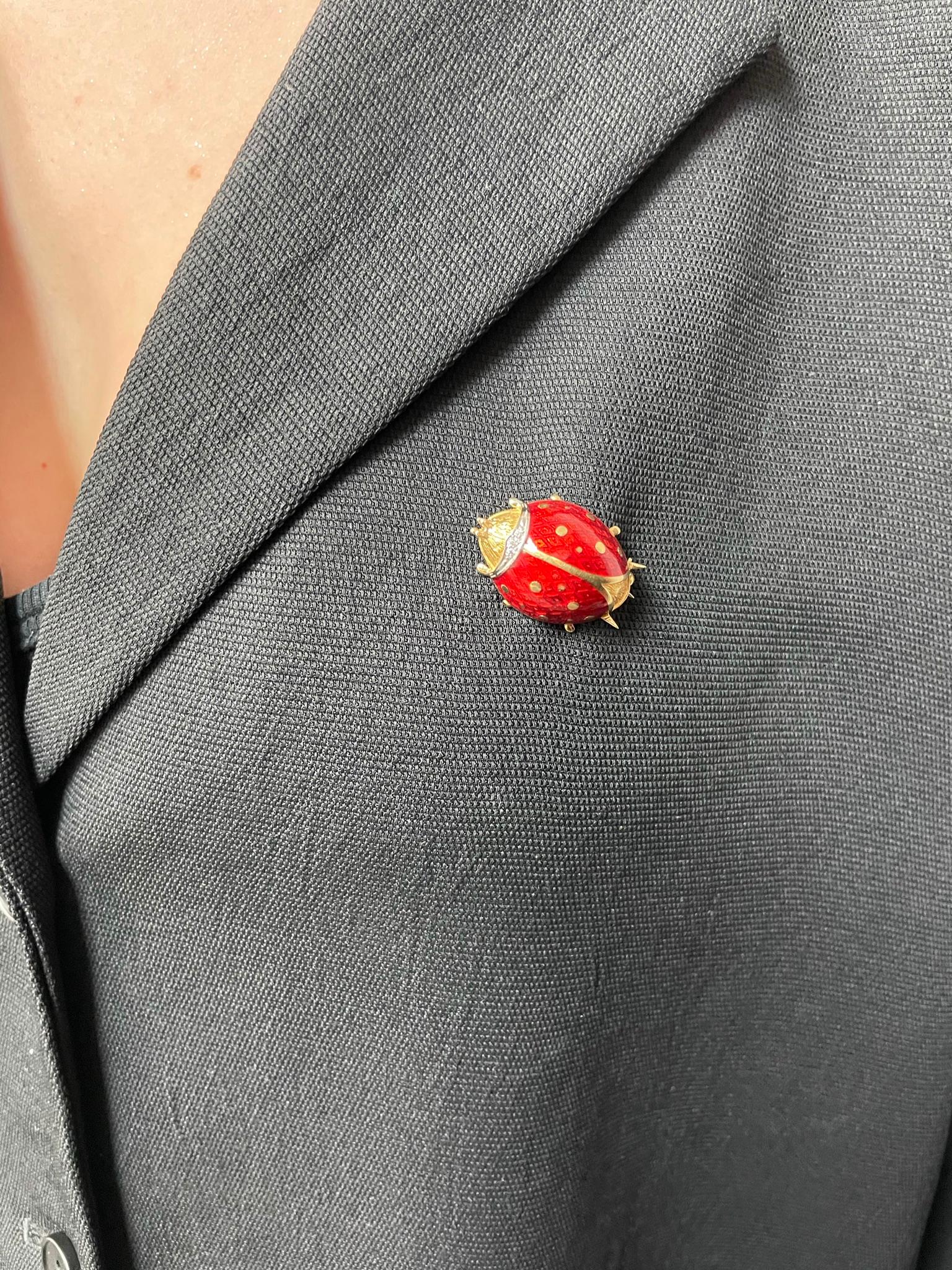 A Van Cleef & Arpels Ladybug Brooch Pin with Diamonds made in 18 Karat Yellow Gold. The length is 1 inch and the width is 0.50 inches. Stamped 