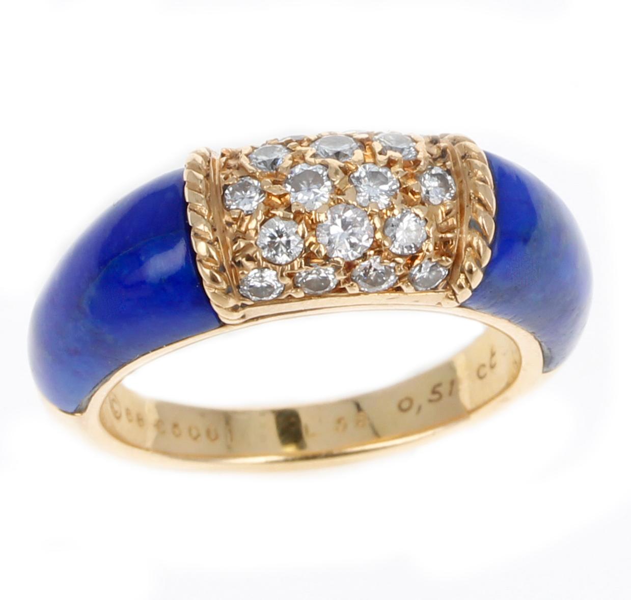 A Van Cleef & Arpels Ring with Two Carved Lapis Inlays and 5 Row Diamond Stacking Philippine Ring made in 18K Yellow Gold. There are 5 rows of diamonds, totaling to 15 round diamonds. The total weight is 7.68 grams. 

SKU: 1463-BAJJP