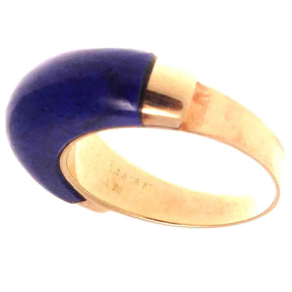From  Van Cleef & Arpels, a spare and lovely designed ring with multi hued royal blue lapis lazuli. Hand crafted in glistening 18k yellow gold. Signed VCA, numbered and stamped with French hallmarks. Contact us if you are interested in purchasing