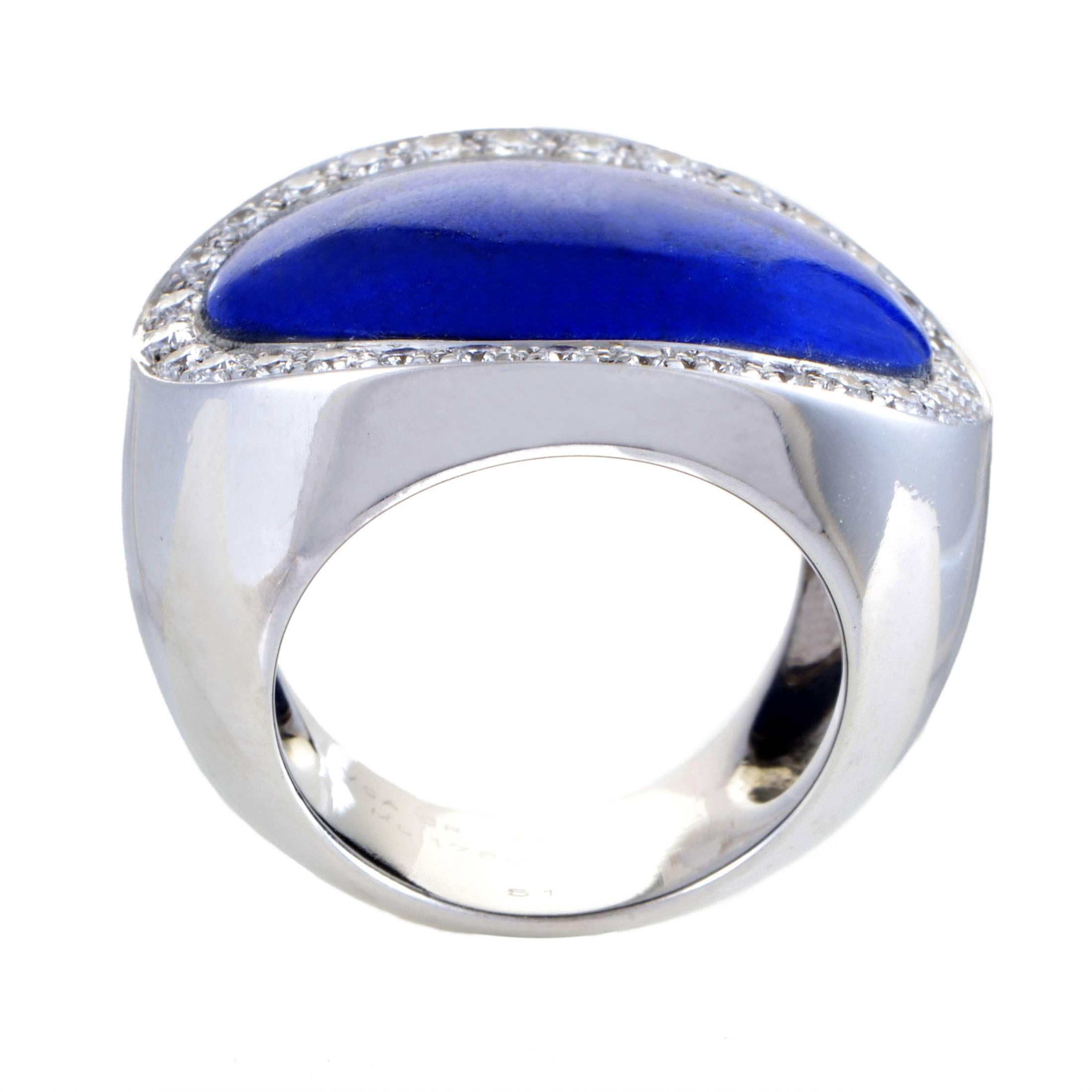 In keeping with the spotlessly polished surface of 18K white gold, the splendid Lapis Lazuli in this marvelous ring from Van Cleef & Arpels also boasts an immaculate gleam, brought out in brilliant fashion by the sparkling diamonds around it