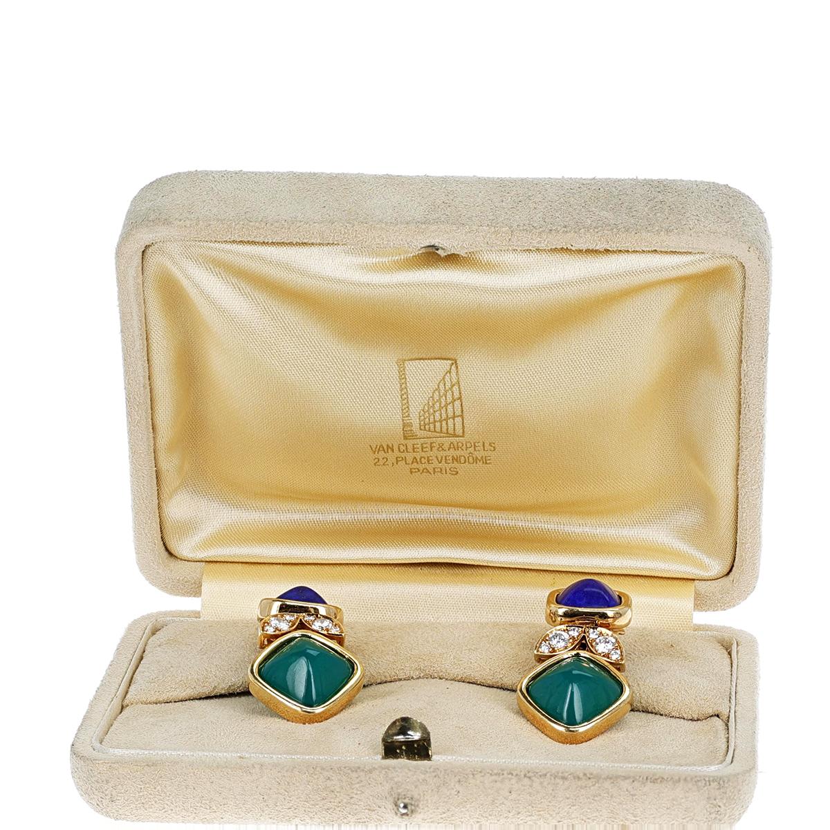 An elegant and chic pair of earrings by Van Cleef & Arpels, bezel-set with alternating pyramidal-shaped lapis lazuli and chrysoprase cabochons masterfully spaced with round brilliant-cut diamonds. The earrings are engraved VCA with numbers, and