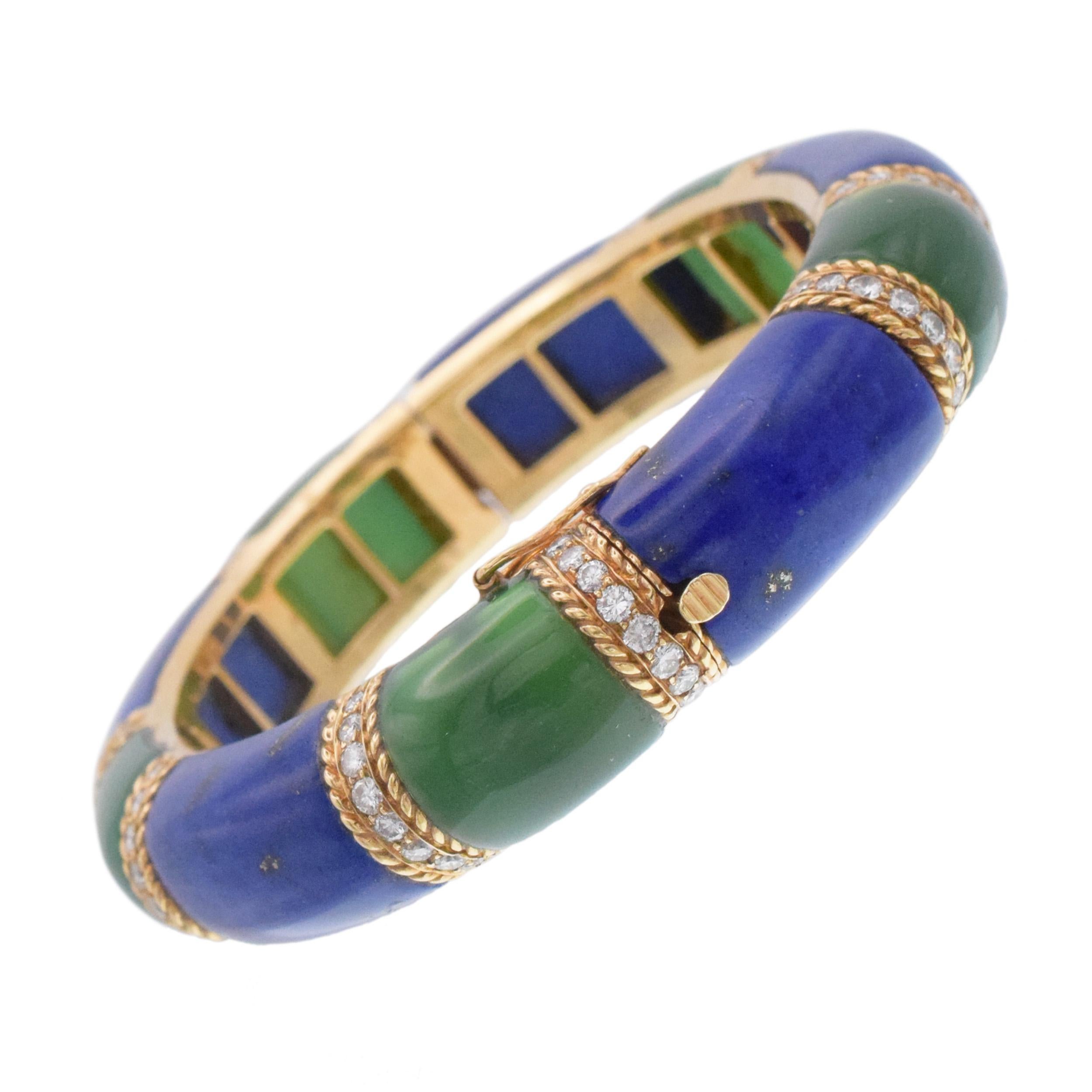 Van Cleef & Arpels Lapis Lazuli, Green Onyx and Diamond Bangle Bracelet In 18k Yellow Gold.Inscribed: Van Cleef & Arpels, Made in France, '68, no. XVXXXX, with maker's marks. Encrusted with 90 round diamonds with total weight of approximately