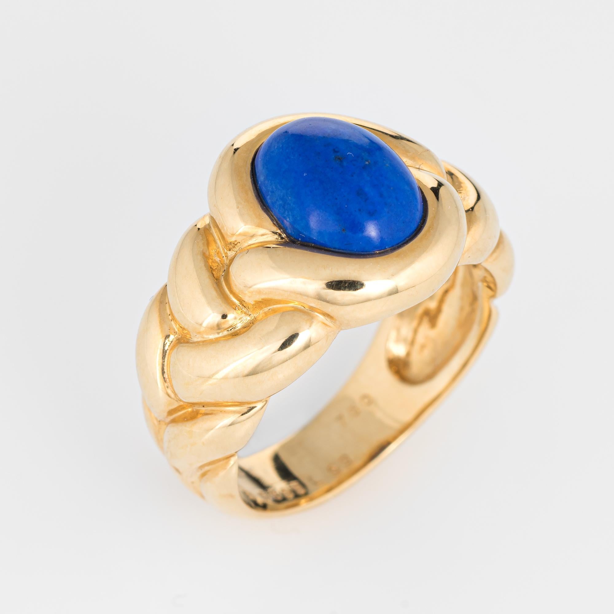 Elegant vintage Van Cleef & Arpels braided ring crafted in 18 karat yellow gold. 

Cabochon cut lapis lazuli measures 10mm x 8mm (estimated at 2.75 carats). The lapis is in excellent condition and free of cracks or chips.

The ring is in excellent