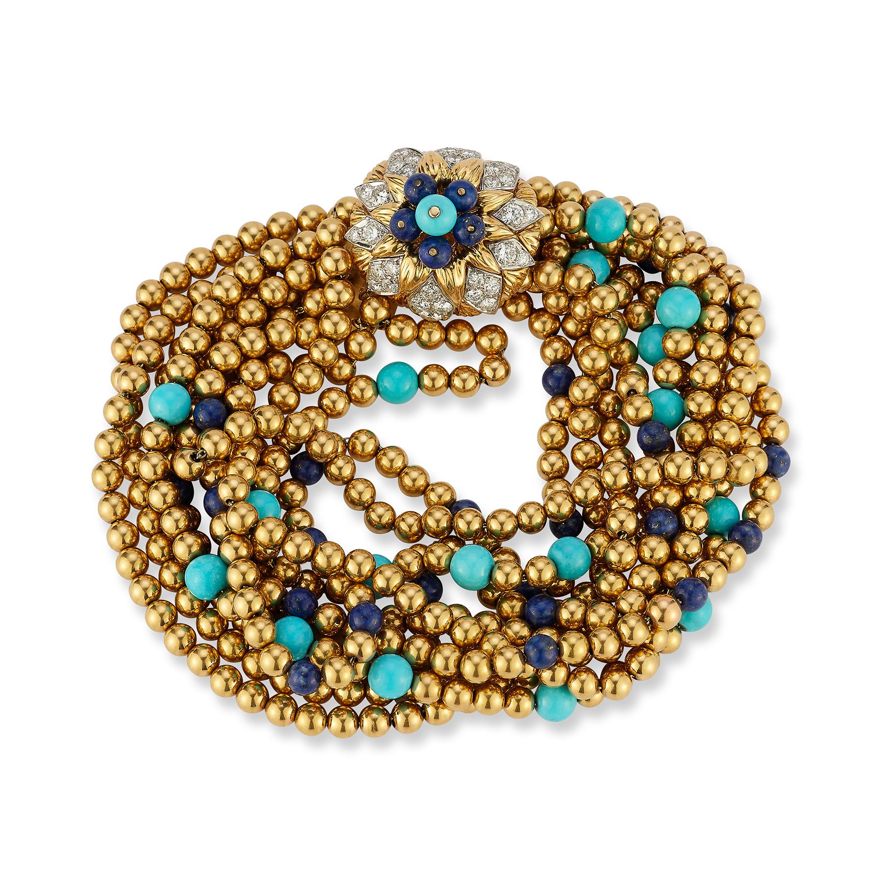 Van Cleef & Arpels Lapis Lazuli & Turquoise Torsade Bracelet

An 18 karat gold beaded bracelet consisting of 10 strands of gold beads, with beads of lapis and turquoise artfully placed throughout. The clasp consists of round cut diamonds and beads