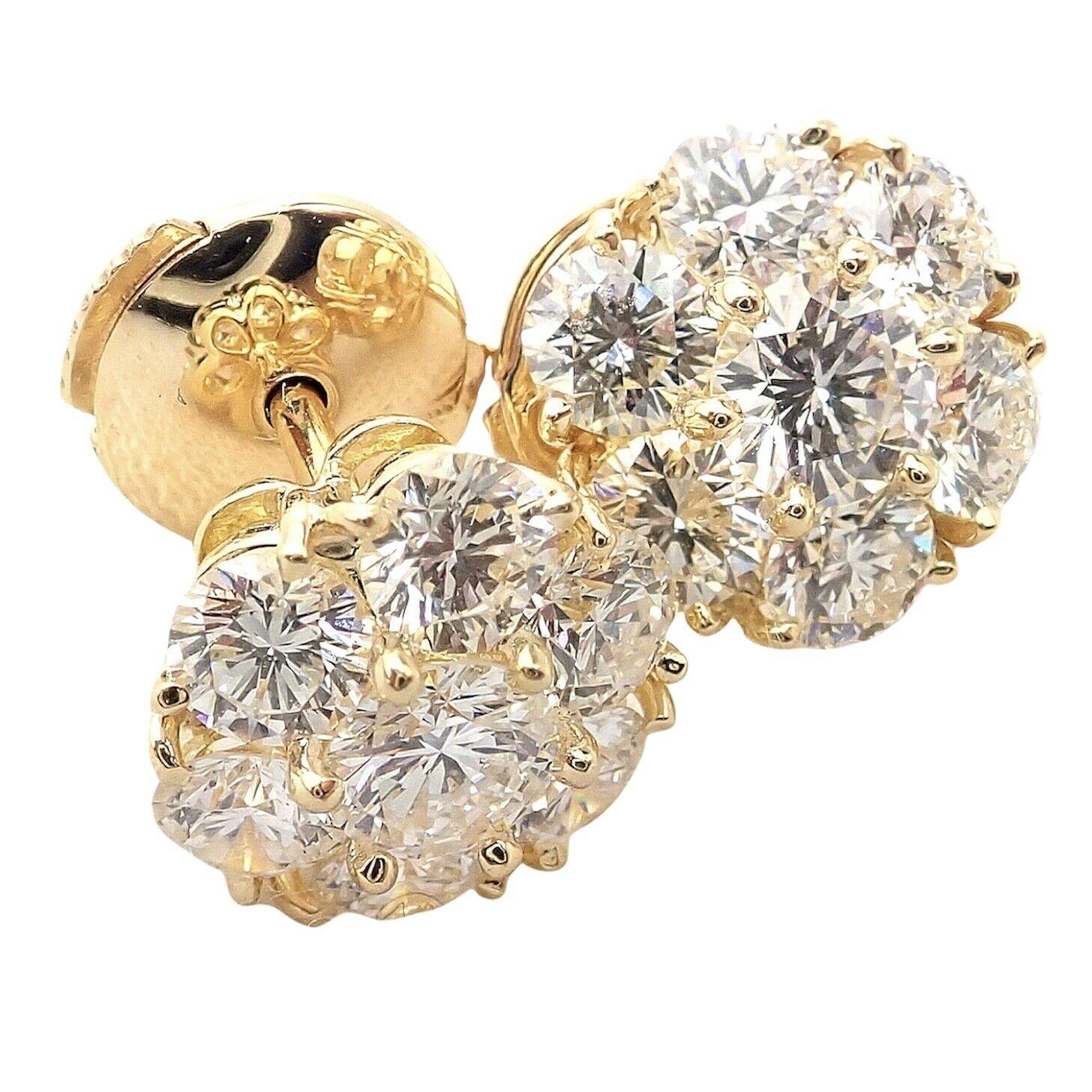 18k Yellow Gold Diamond Large Fleurette Flower Earrings by Van Cleef & Arpels. 
With 14 round brilliant cut diamonds VVS1 clarity, E color total weight approx. 1.88ct
These earrings come with Van Cleef & Arpels box and a service paper from a VCA