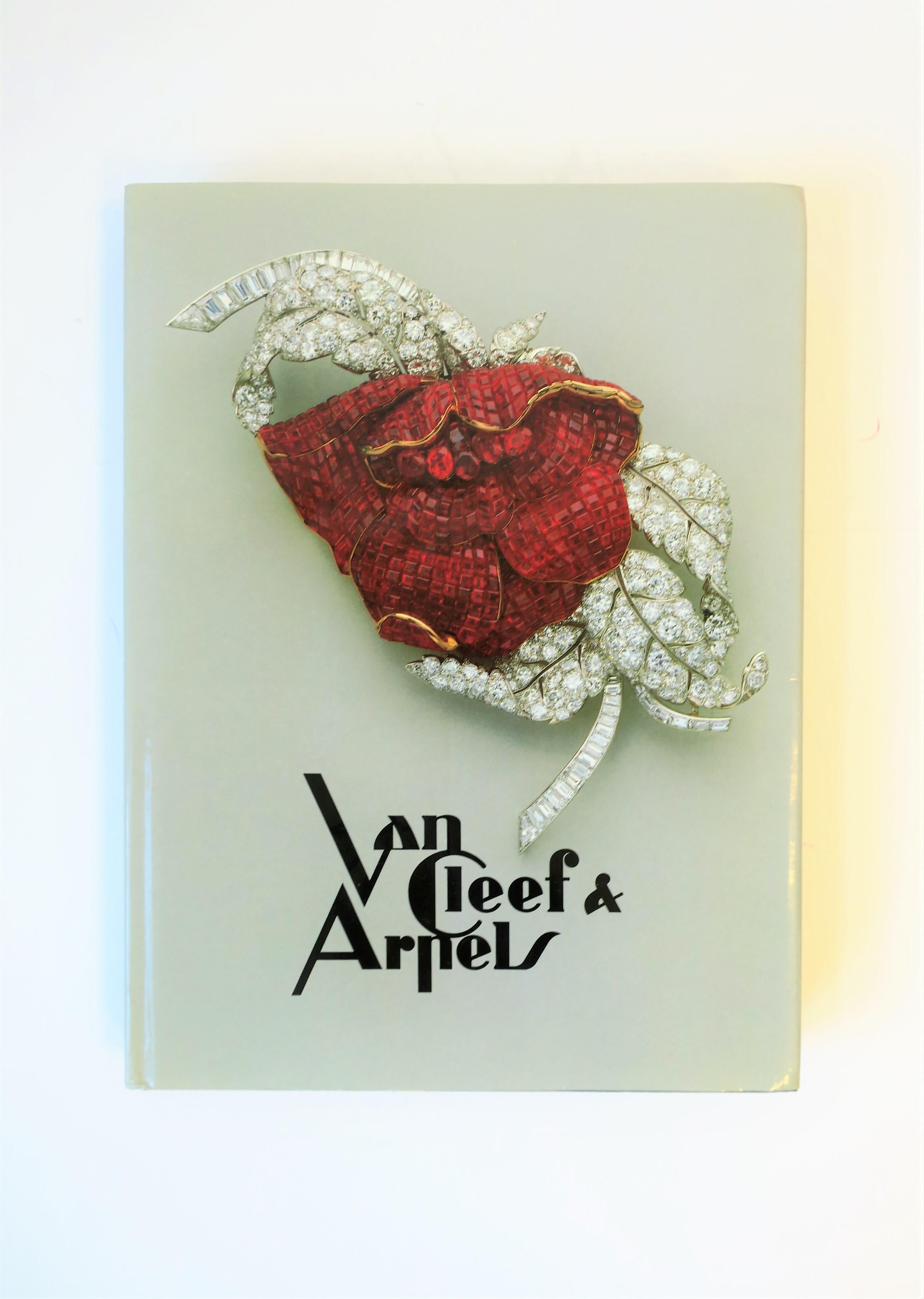 A very beautiful library or coffee table book from French luxury jeweler Van Cleef & Arpels, capturing the Art Deco period of the 1930s and beyond. Book is first addition 1986-987. Book was printed and bound in Switzerland. Cover/dust jacket is a