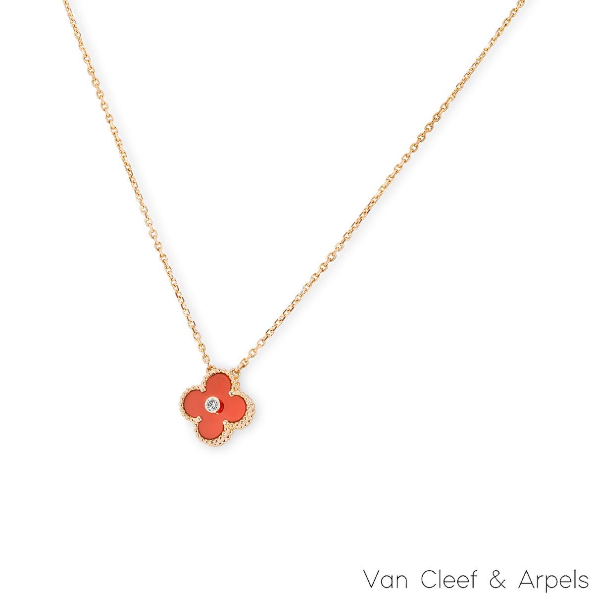 A limited edition 18k rose gold carnelian and diamond Van Cleef & Arpels Vintage Alhambra pendant from the 2011 Holiday collection. The pendant features a beaded edge 4 leaf clover motif with a carnelian inlay. Further complementing the carnelian