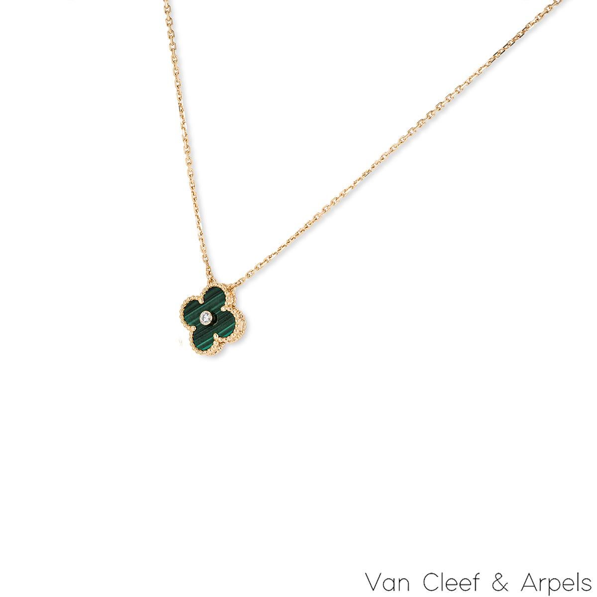 A limited edition 18k yellow gold malachite and diamond Van Cleef & Arpels Vintage Alhambra pendant from the 2013 Holiday collection. The pendant features a beaded edge 4 leaf clover motif with a malachite inlay. Further complementing the malachite