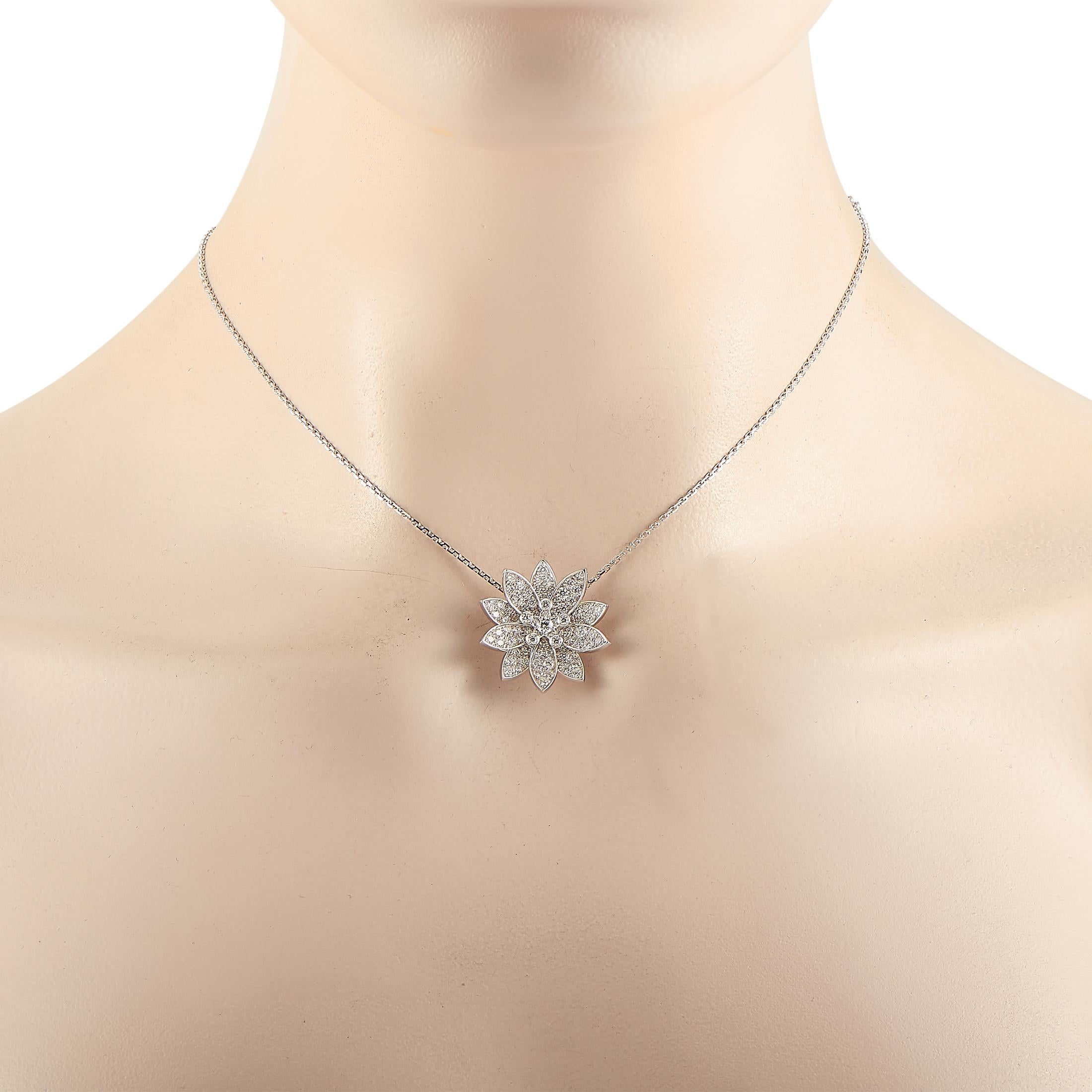 The Van Cleef & Arpels “Lotus” necklace is made of 18K white gold and embellished with diamonds. The necklace weighs 9.4 grams and boasts a 16” chain and a pendant that measures 1” in length and 1” in width.

This jewelry piece is offered in estate