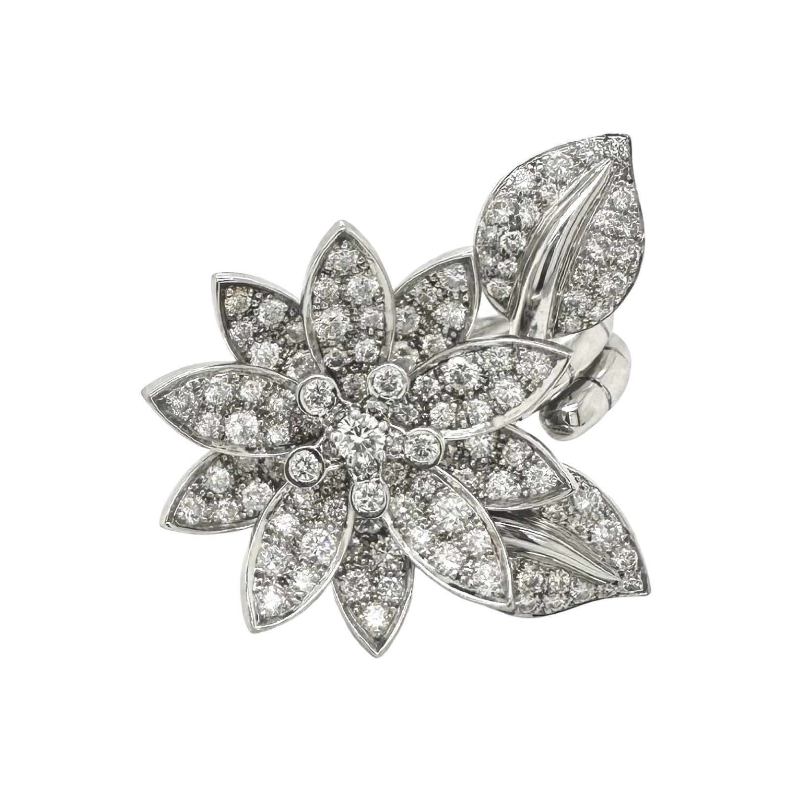Designer: Van Cleef & Arpels
Collection: Lotus Between the Finger
Style: Ring that can either be worn on one finger or on two fingers
Size: European 52
Material: 18k White Gold
Stones: 127 Diamonds
Total Carat Weight: 2.13 ct
Includes: Original Box