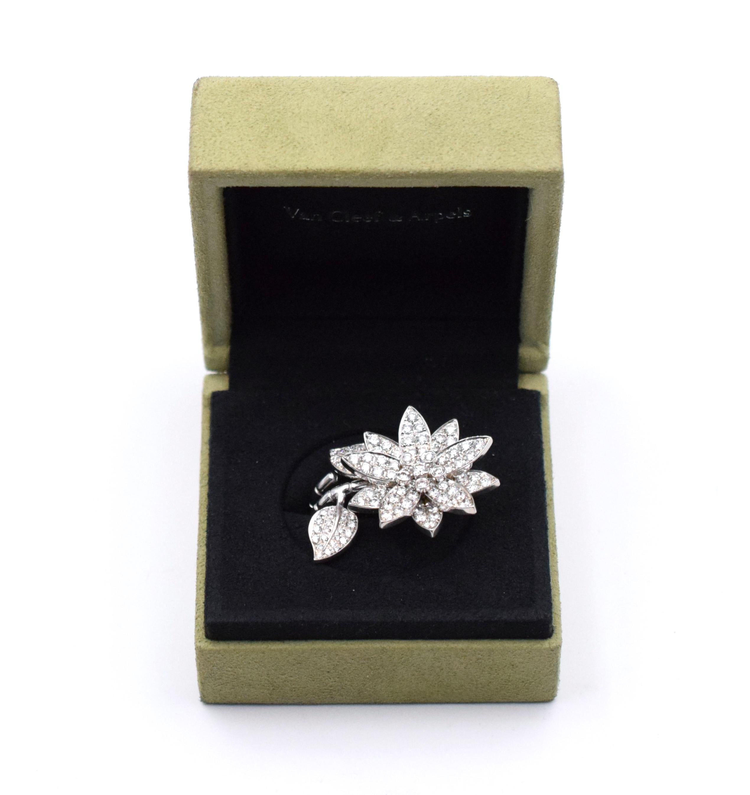 Van Cleef & Arpels Lotus Between Finger Ring. This ring has a lotus motif with diamonds for a total carat weight of approximately 2ct.. Ring  Size: 51   (US 5.3/4) 
 Signed: VCA 750 and # xxxxx  51  With VCA box 
(Currently priced at