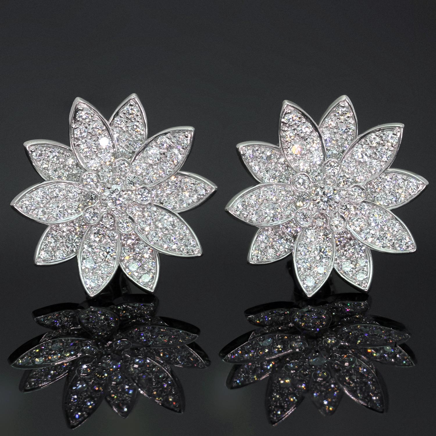 These magnificent floral earrings from the iconic Lotus collection by Van Cleef & Arpels are crafted in 18k white gold and pave-set with round brilliant D-F VVS1-VVS2 diamonds weighing an estimated 3.30 carats Made in France circa 2010s.