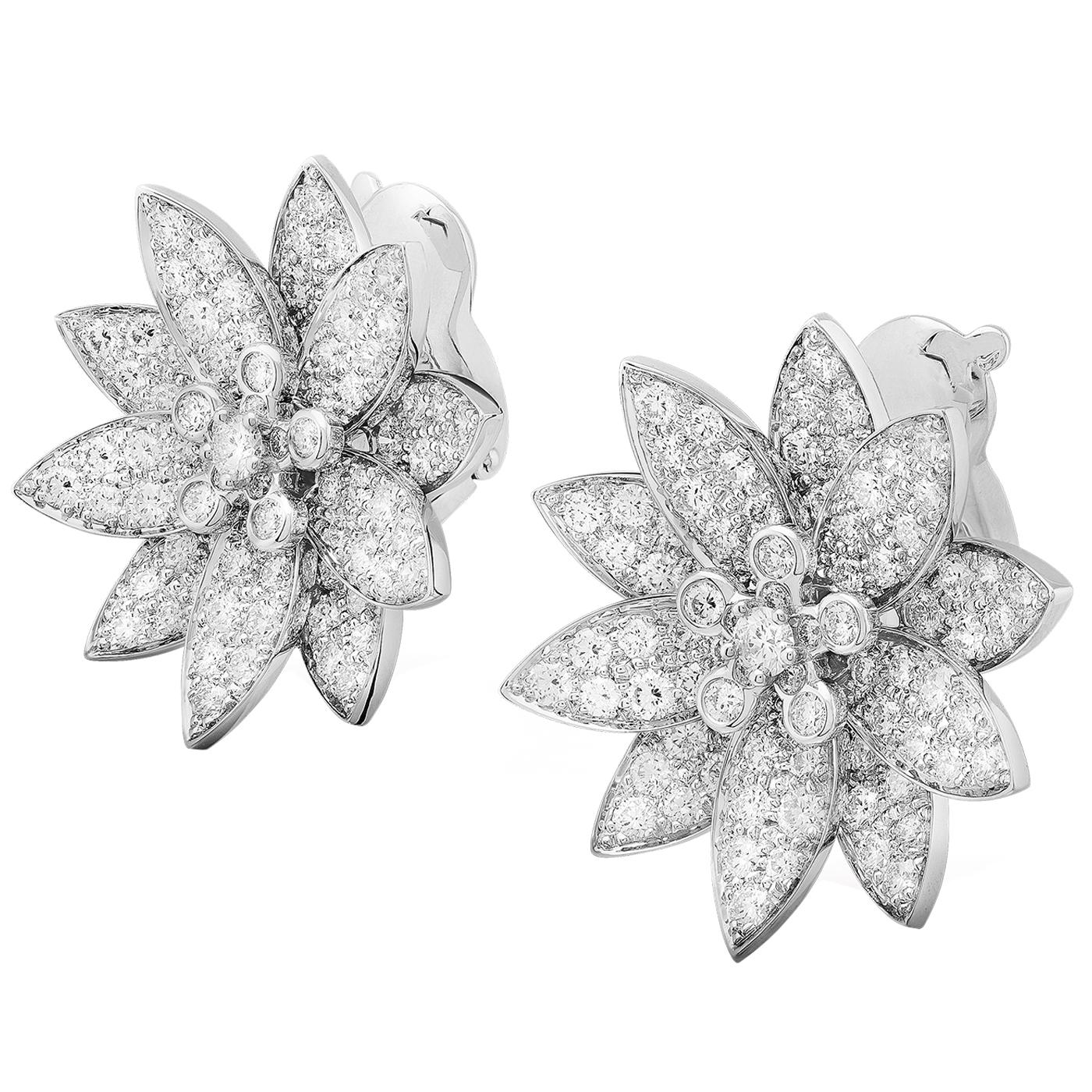 Lotus earrings, medium model, rhodium plated 18K white gold, round diamonds; diamond quality DEF, IF to VVS.

Details:
Brand: Van Cleef & Arpels
Type: Lotus Earrings
Stone Type: Round Cut Diamonds
Model: Medium Model
Carat Weight: 3.29