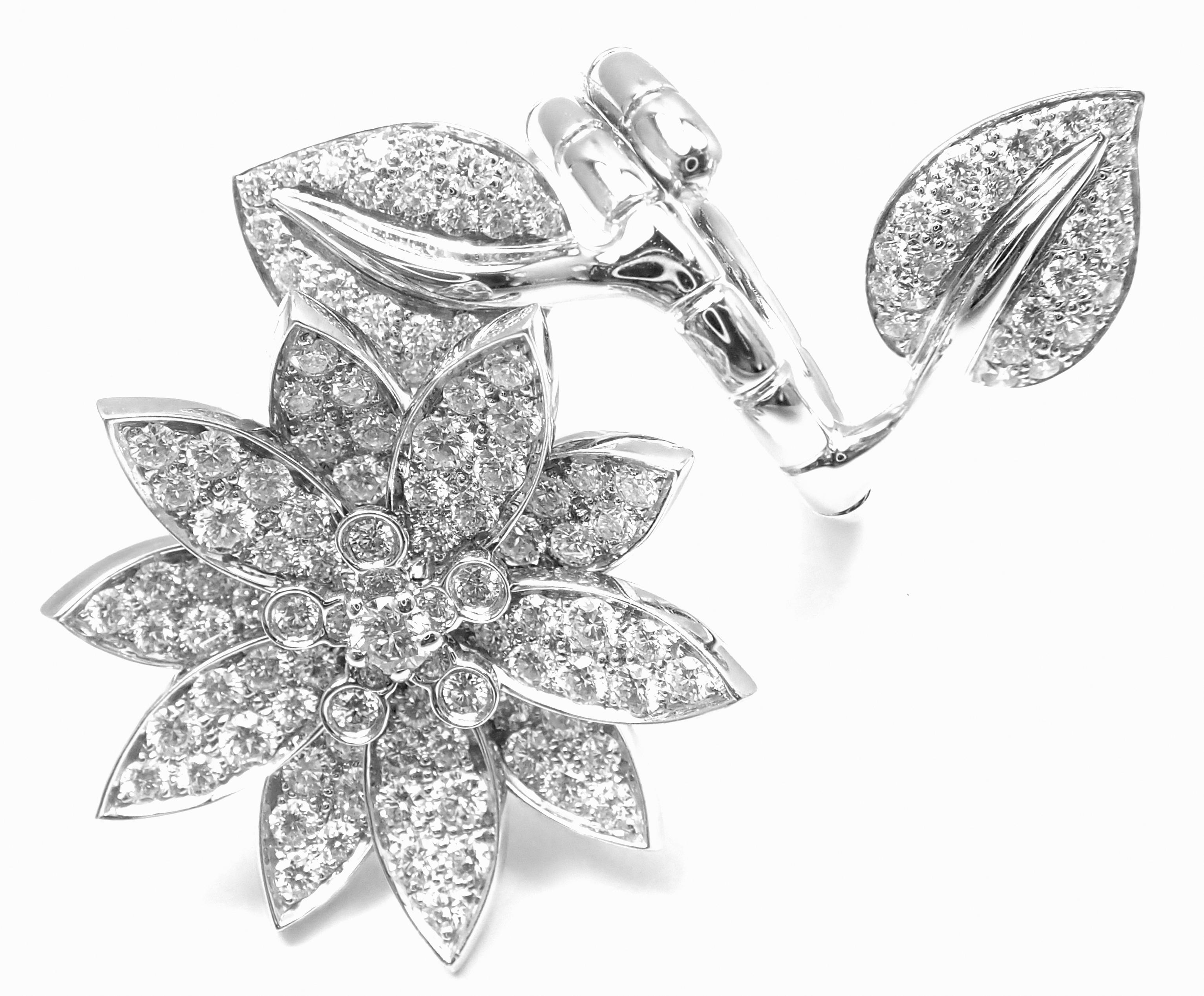 18k White Gold Lotus Flower Diamond Between The Finger Ring by Van Cleef & Arpels.  
With 127 round brilliant cut diamonds VVS1 clarity, E color
total weight approx. 2.13ct 
This ring comes with Van Cleef & Arpels box.  
Details:  
Weight: 20.5