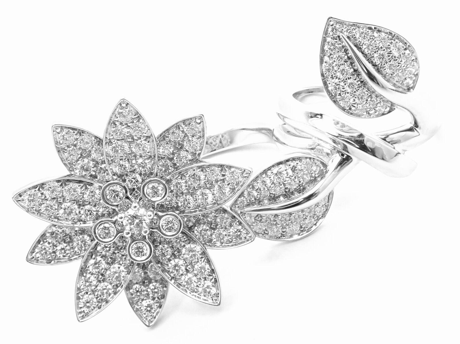 18k White Gold Lotus Flower Diamond Between The Finger Ring by Van Cleef & Arpels.  
With 127 round brilliant cut diamonds VVS1 clarity, E color
total weight approx. 2.13ct 
This ring comes with certificate of authenticity from Van Cleef & Arpels