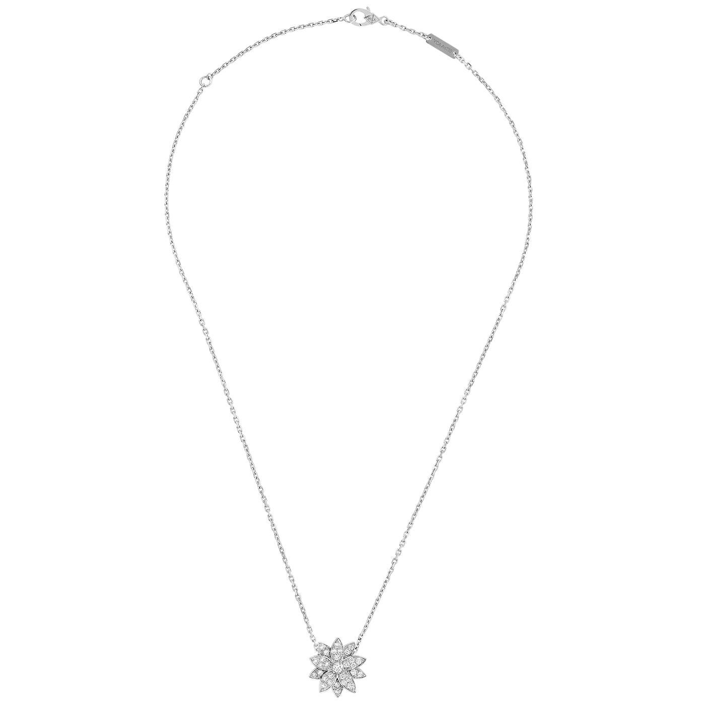 Lotus pendant, small model, rhodium plated 18K white gold, round diamonds; diamond quality DEF, IF to VVS. The pendant is attached to the necklace’s chain

Details:
Brand: Van Cleef & Arpels
Type: Lotus Pendant
Stone Type: Round Cut Diamonds
Model: