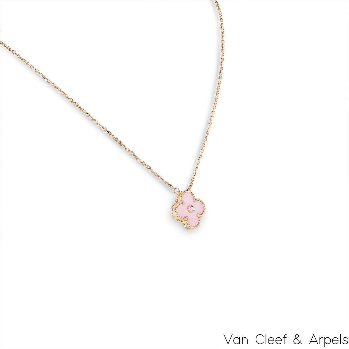 A limited edition 18k rose gold pink porcelain and diamond Van Cleef & Arpels Vintage Alhambra pendant from the 2015 Holiday collection. The pendant features a beaded edge 4-leaf clover motif with a Pink Sèvres porcelain inlay. Van Cleef & Arpels