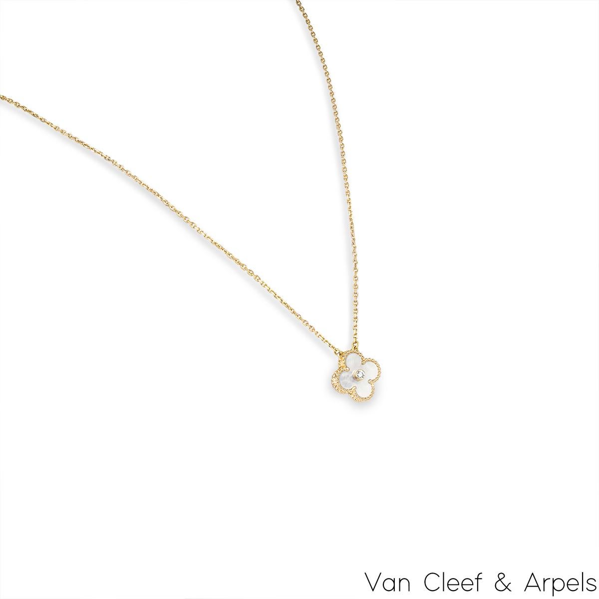 A limited edition 18k rose gold mother of pearl and diamond Van Cleef & Arpels Vintage Alhambra pendant from the 2012 Holiday collection. The pendant features a beaded edge 4 leaf clover motif with a mother of pearl inlay. Further complementing the