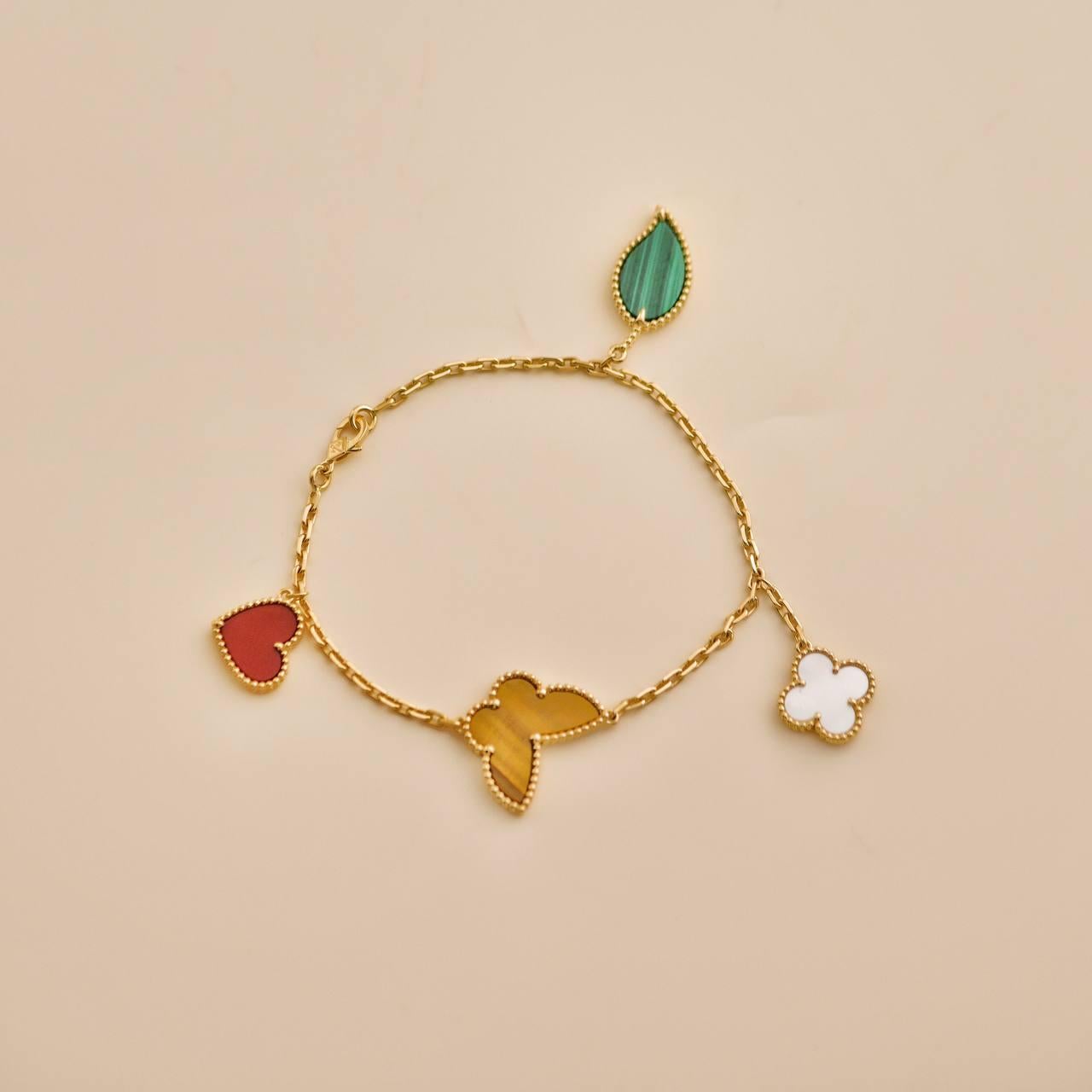 Women's or Men's Van Cleef & Arpels Lucky Alhambra 4 Motifs 18K Yellow Gold Bracelet For Sale