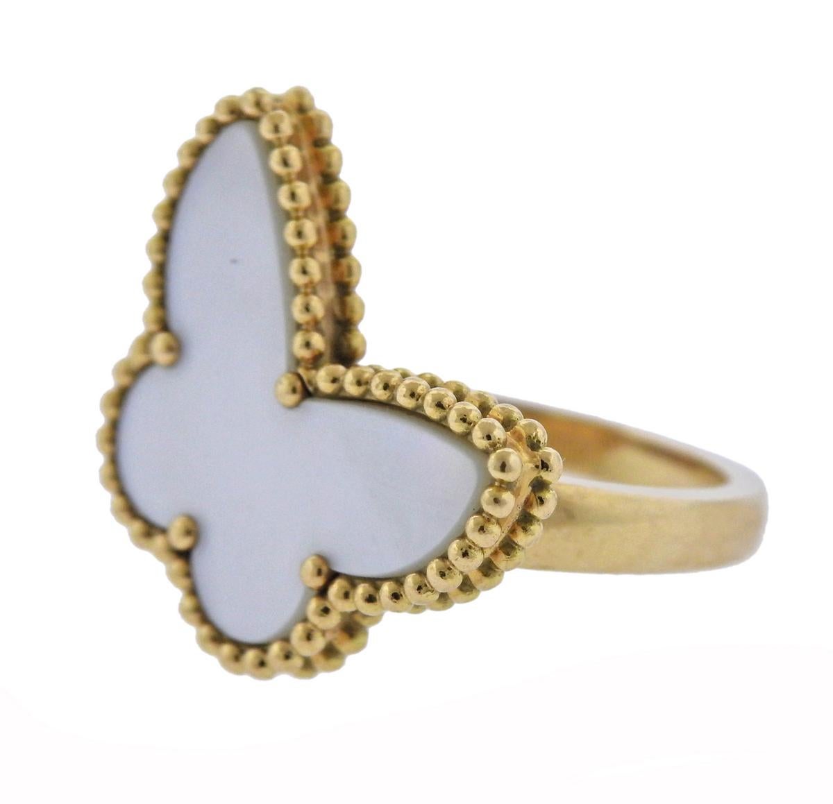  18k yellow gold Lucky Alhambra ring, featuring butterfly motif, crafted by Van Cleef & Arpels, set with mother of pearl. Retail $3700. Ring size - 5.25, ring to - 22mm x 16mm, weighs 9.6 grams. Marked: VCA, 750, BL 201***, 49.
