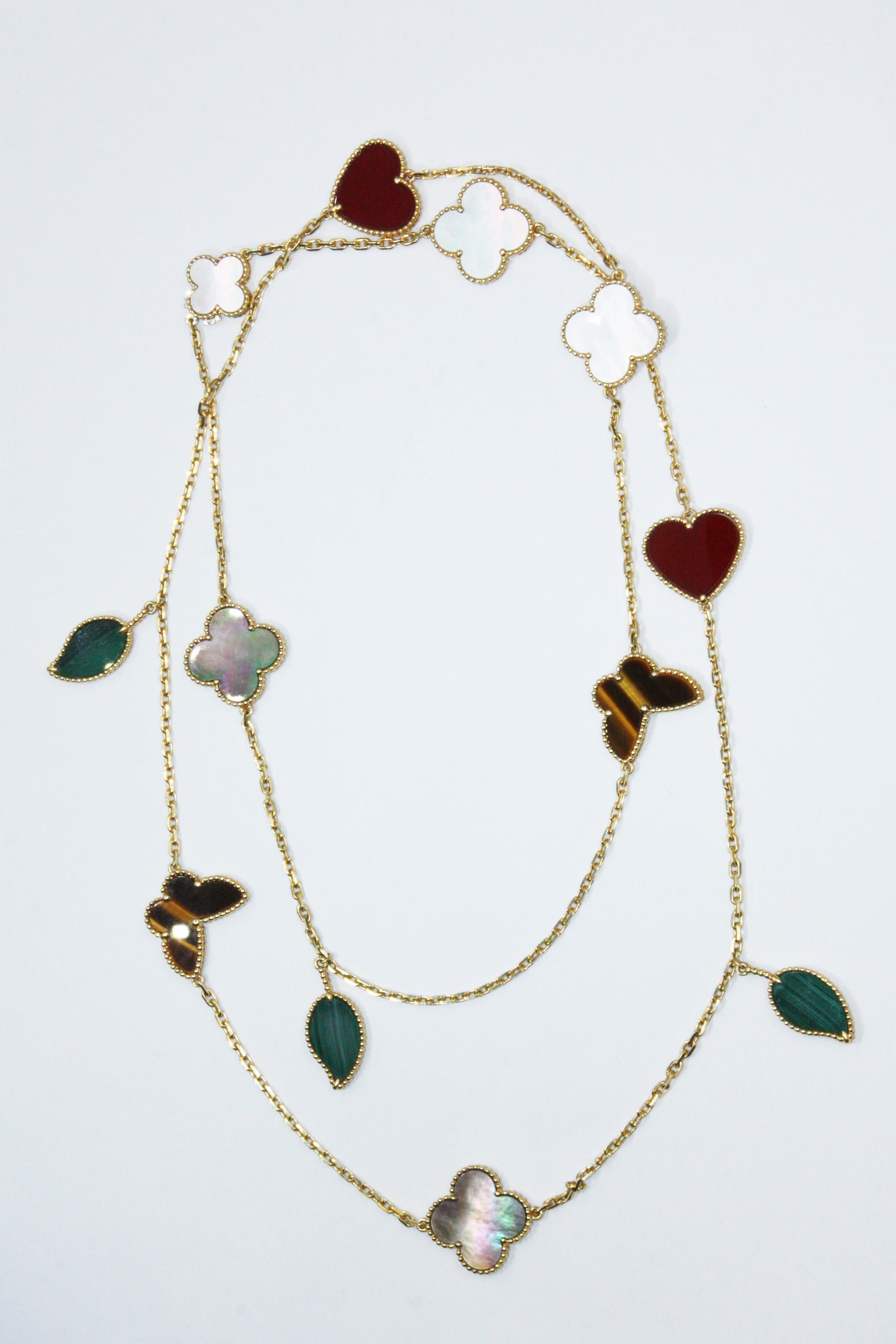 A beautiful Lucky Alhambra long necklace from Van Cleef & Arpels, made in 18k yellow gold set with 12 motifs including Mother-of-pearl, Malachite, Tiger Eye and Carnelian. RE: VCARD80100

The Necklace set with 2 Carnelian, 3 Malachite, 2 Tiger Eye