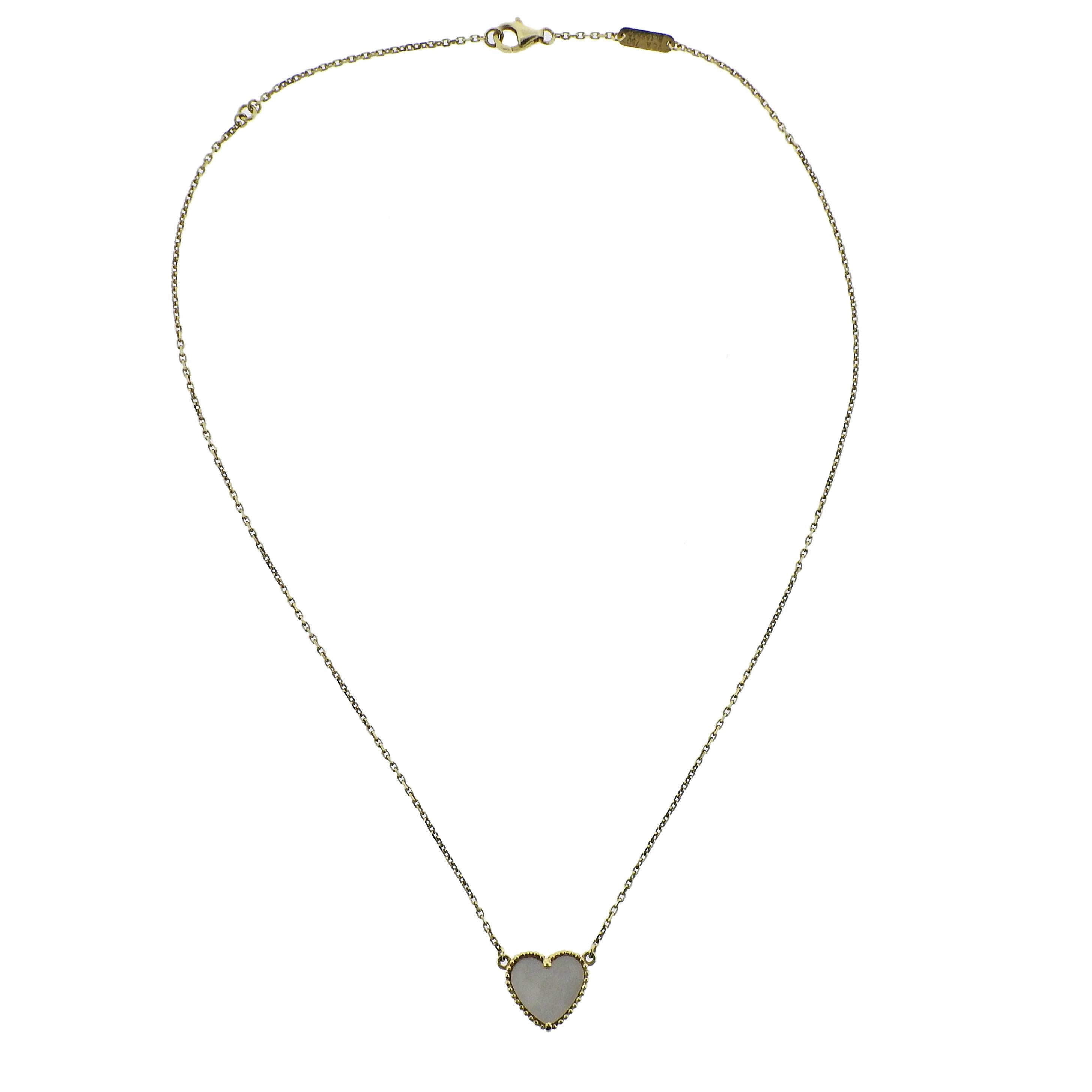 18k gold necklace by Van Cleef & Arpels, crafted for Lucky Alhambra collection, featuring heart pendant, set with mother of pearl.  Necklace is 17