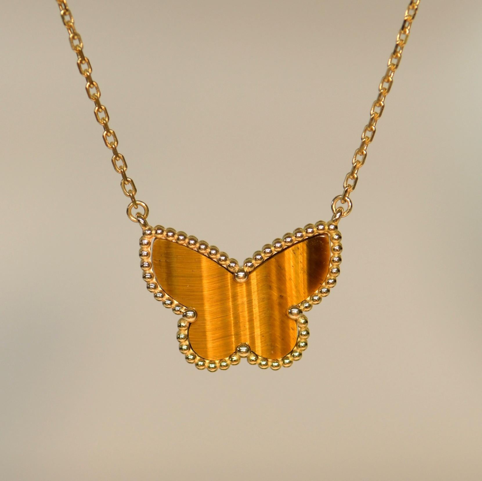 A classic Van Cleef & Arpels Tiger Eye pendant necklace.

This is the kind of piece that will become a staple of your jewellery collection. You will find yourself reaching for it time after time. It will go with almost any outfit and add a splash of