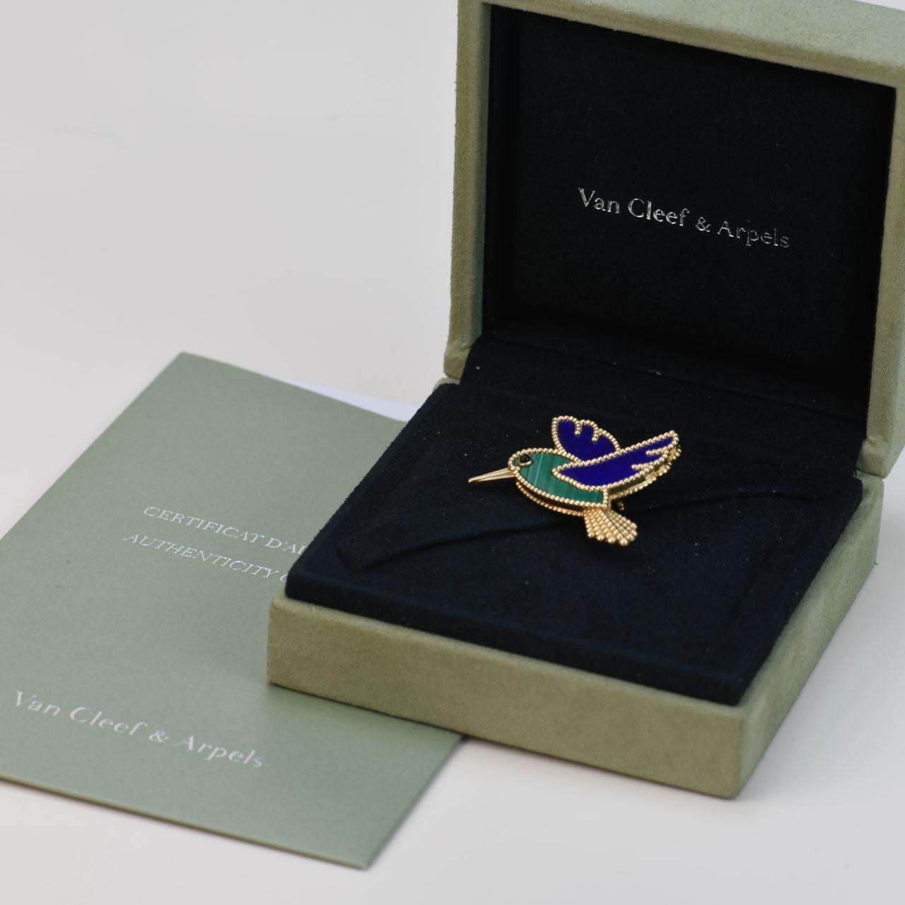 SKU	CT-2403
Comes With	Full Set (Box + Card)
Date	2019
Model	Lucky Animals
Serial Number	VCARP2B000
Metal	18k Yellow Gold
Stones	Sapphire, Lapis Lazuli, Malachite
Weight	Approx 14.7 g
Condition	Excellent
Other Info	Size:Approx 4.2 x Approx 3.8
