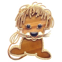 Van Cleef & Arpels Broche Lucky Animals lion onyx œil de tigre en or jaune