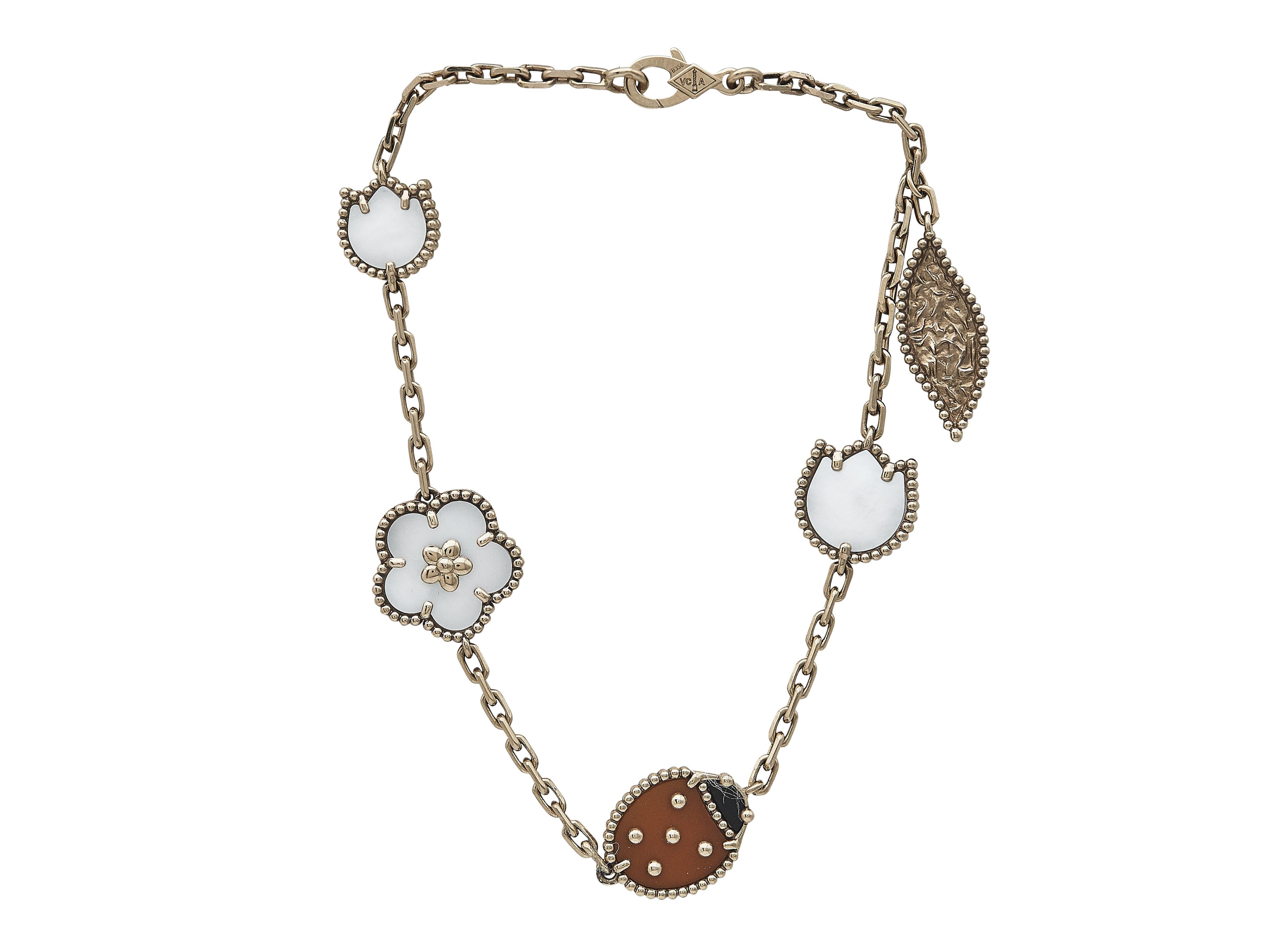 The bracelet: A Van Cleef & Arpels Lucky Spring eighteen karat rose gold bracelet. The five motifs include two mother-of-pearl tulips, a mother-of-pearl daisy, a carnelian ladybug with onyx head and a textured rose gold leaf. These whimsical charms
