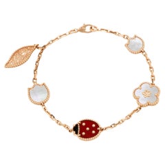 Van Cleef & Arpels, bracelet breloque Lucky Spring 5 à motifs multi-gemmes en or rose 18 carats