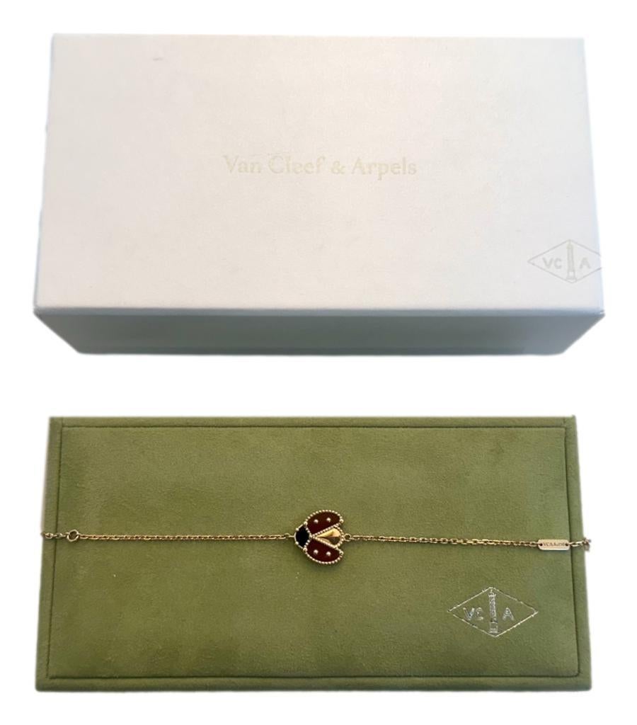 Van Cleef & Arpels Lucky Spring Lady Bug Bracelet In 18k Rose Gold
Lady bug in rose gold, onyx and carnelian with open wings sat on 
gold link chain bracelet with lobster closure. 
Rrp £2.980.
Size - 17cm Length
Condition - Excellent
Composition